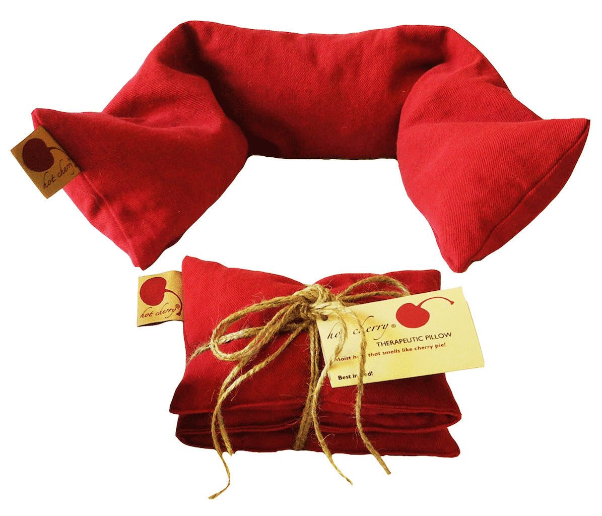 Neck Wrap in vivid red denim cotton, shaped with tapered ends and shown folded with a twine-tied product tag