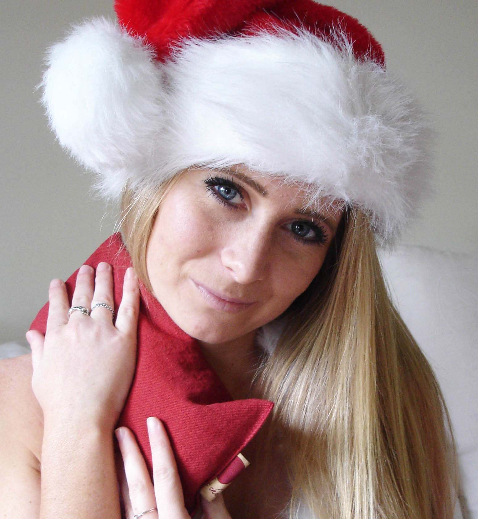 Neck Wrap in plush red ultra-suede fabric, worn around the neck as a soft, tapered scarf