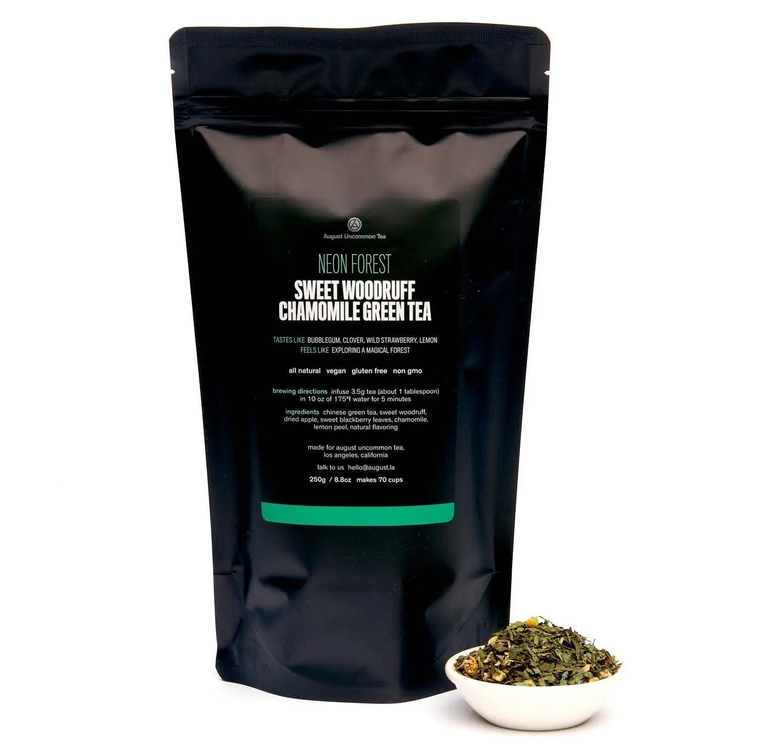 Neon Forest green tea in a black resealable pouch, with a small bowl of loose leafy tea beside it