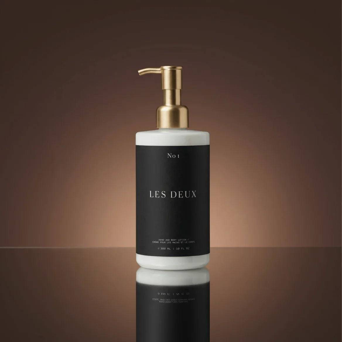 No. 1 - Bois Sacré Body Lotion in a black and white bottle with a gold pump dispenser