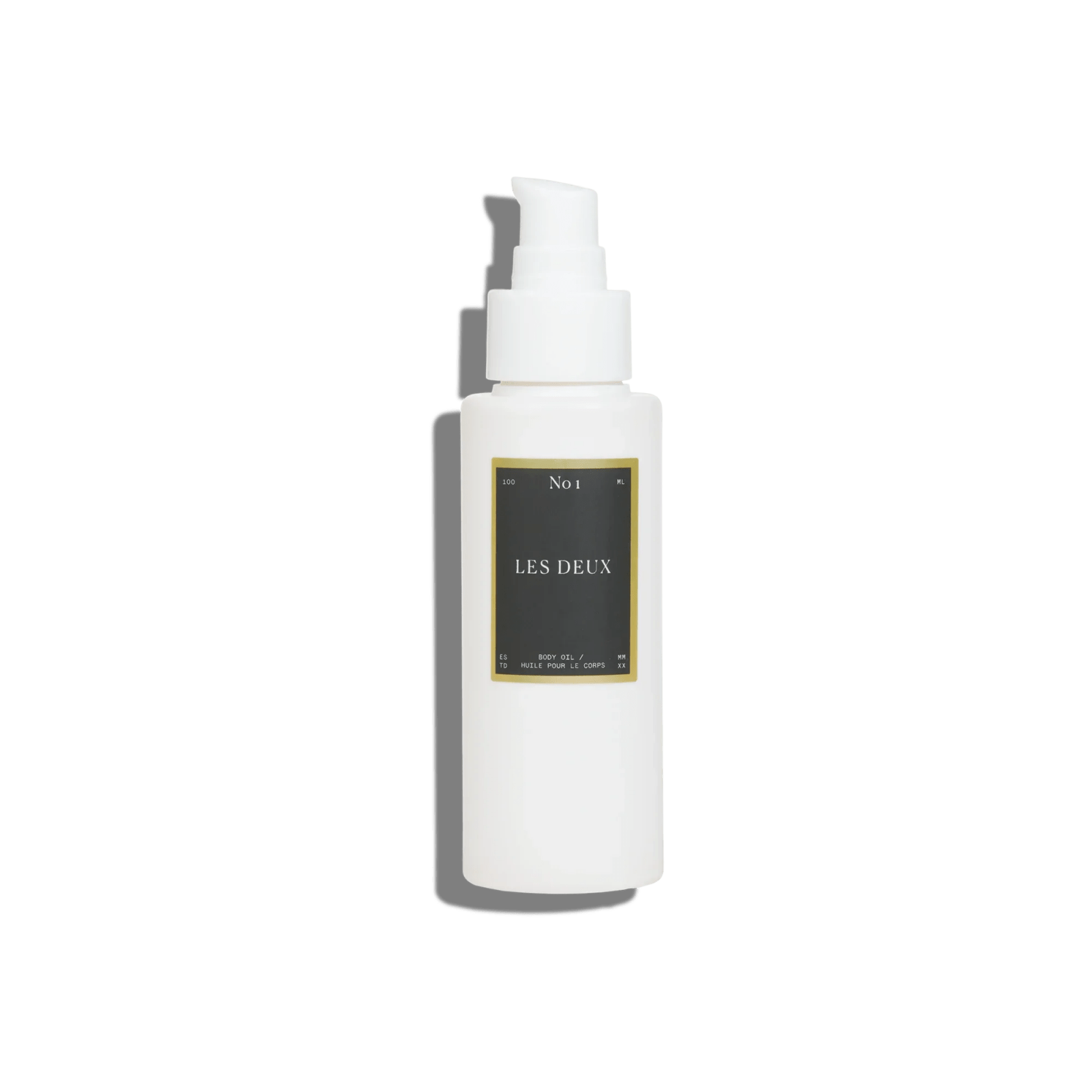 No. 1 - Bois Sacré Body Oil in a white pump bottle with a black and gold rectangular label
