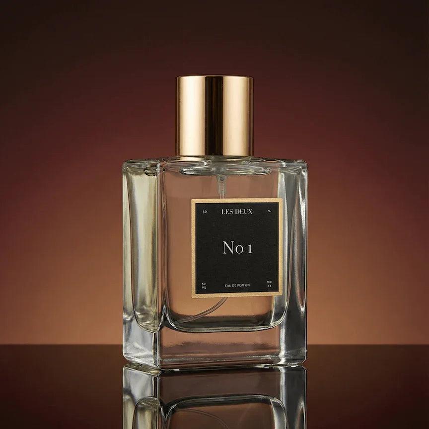 No. 1 - Bois Sacré Perfume in a clear glass bottle with a gold cap and black label