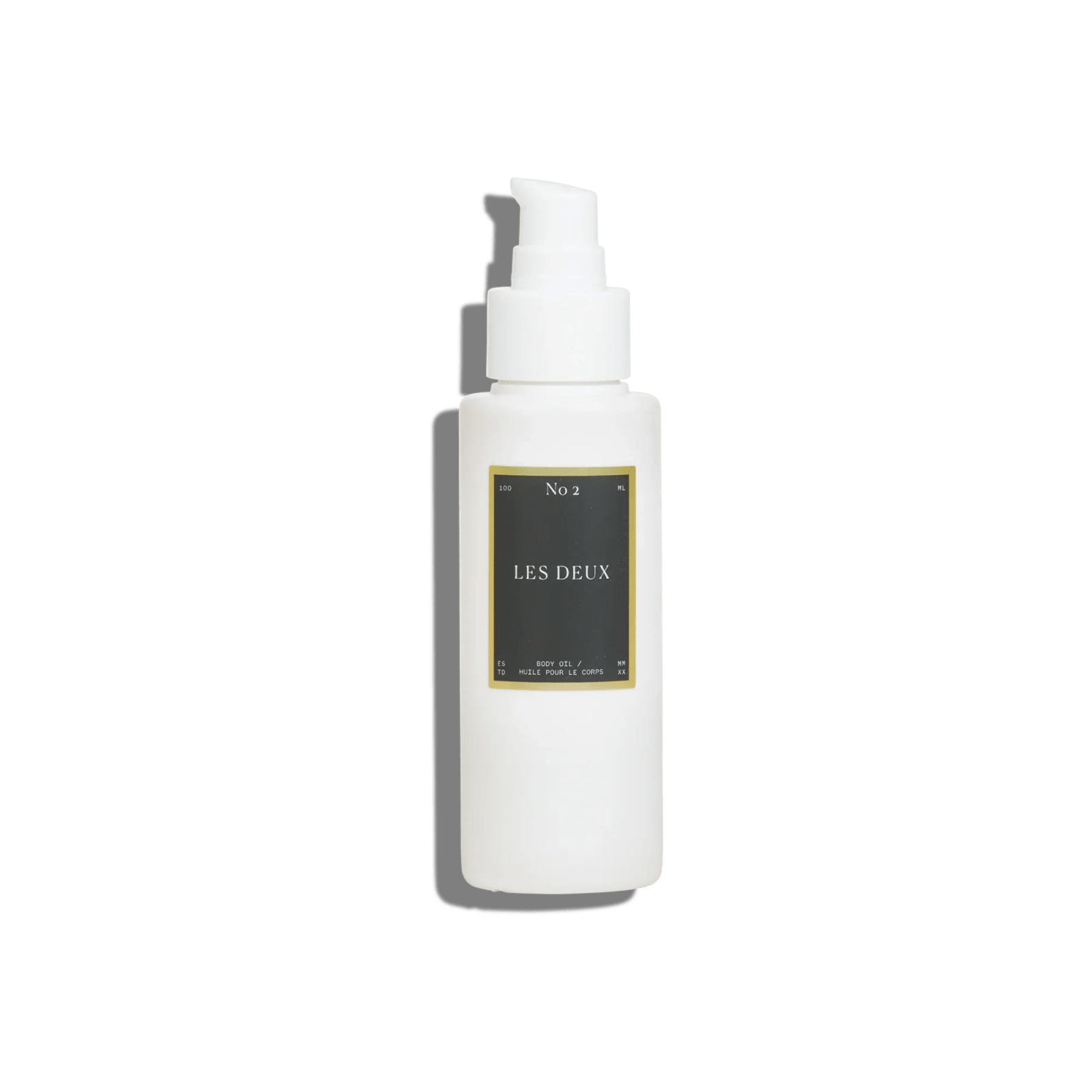 No. 2 - Peau d’Or Body Oil, white pump bottle with a black and gold Les Deux label, 100 ml