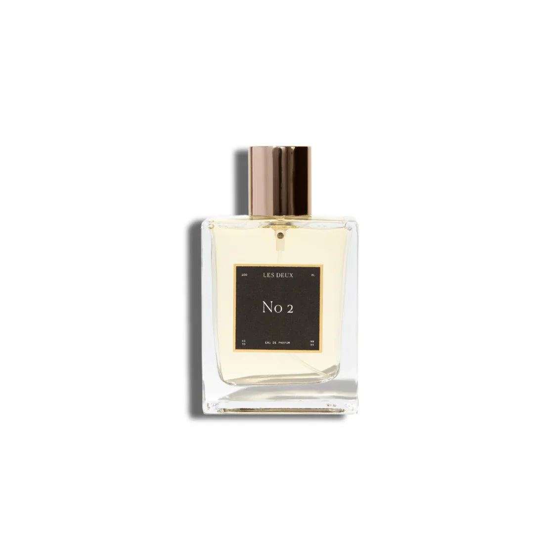 No. 2 - Peau d’Or Perfume in a clear glass bottle with pale amber liquid and gold cap