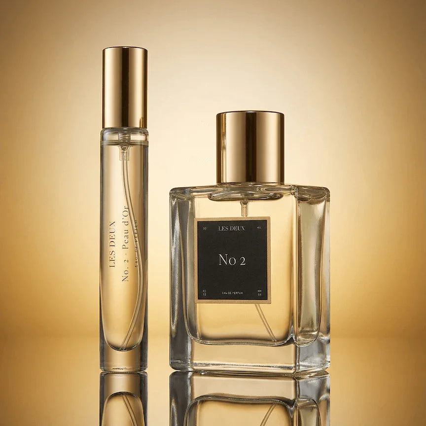 No. 2 - Peau d’Or Perfume in clear glass bottles with golden caps and warm amber fragrance