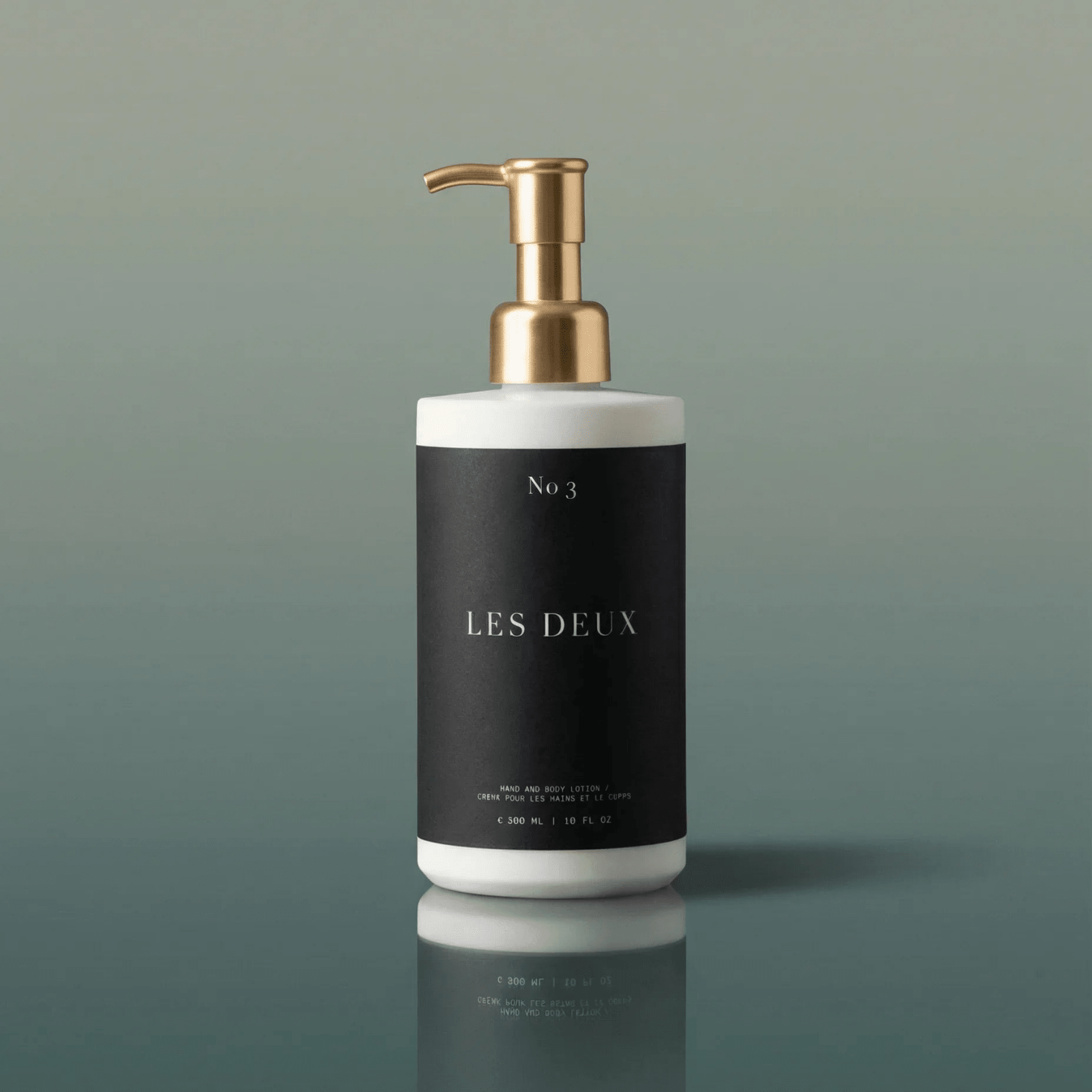 No. 3 - Brume Ardente Body Lotion in a black and white bottle with a gold pump dispenser