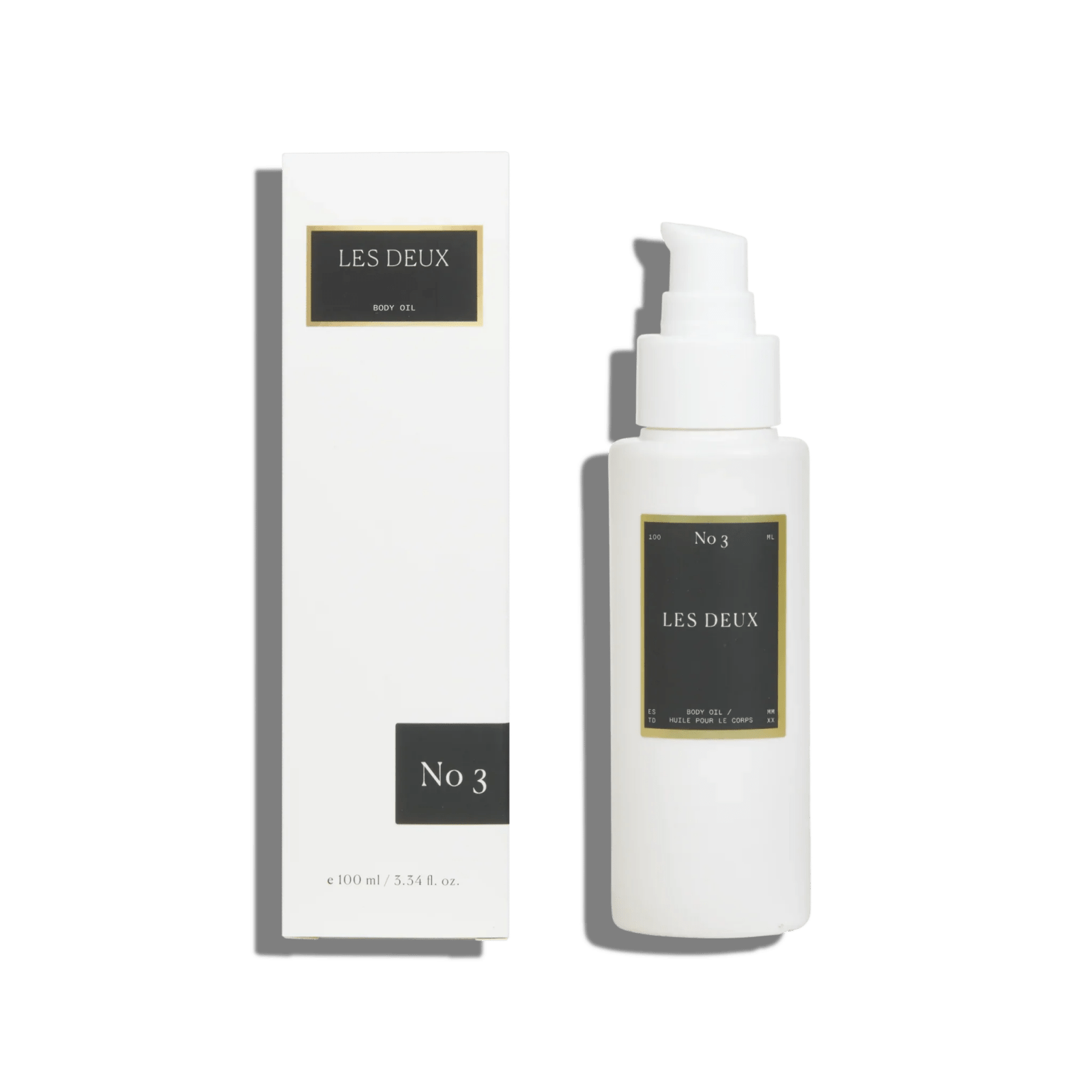 No. 3 - Brume Ardente Body Oil in a white pump bottle with matching white box and black labels