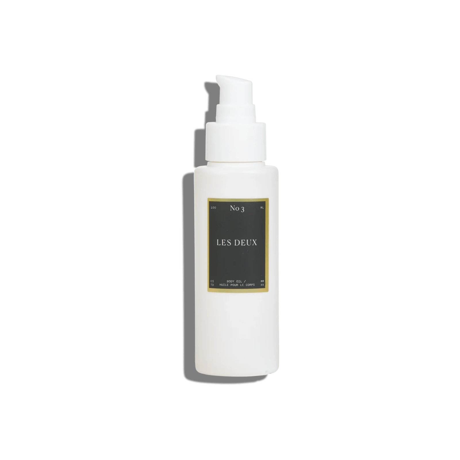 No. 3 - Brume Ardente Body Oil in a white pump bottle with a dark rectangular Les Deux label