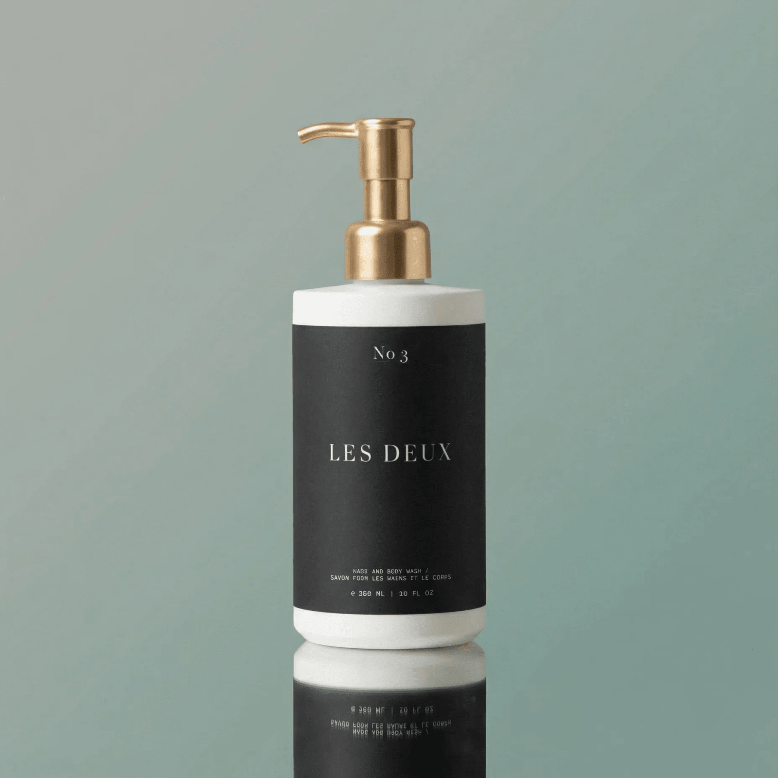 No. 3 - Brume Ardente Body Wash in a black bottle with white label accents and a metallic gold pump