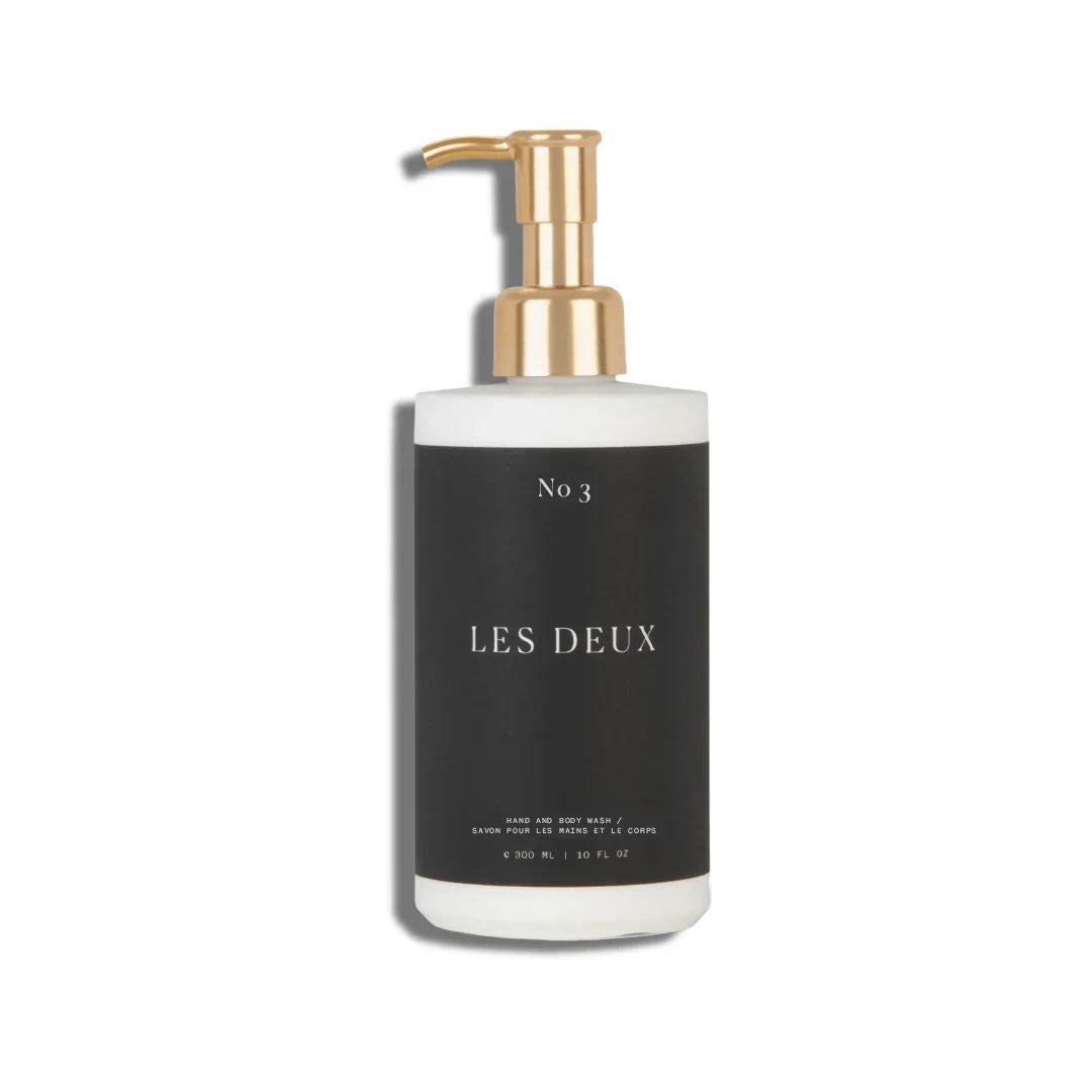No. 3 - Brume Ardente Body Wash in a black and white bottle with a gold pump dispenser