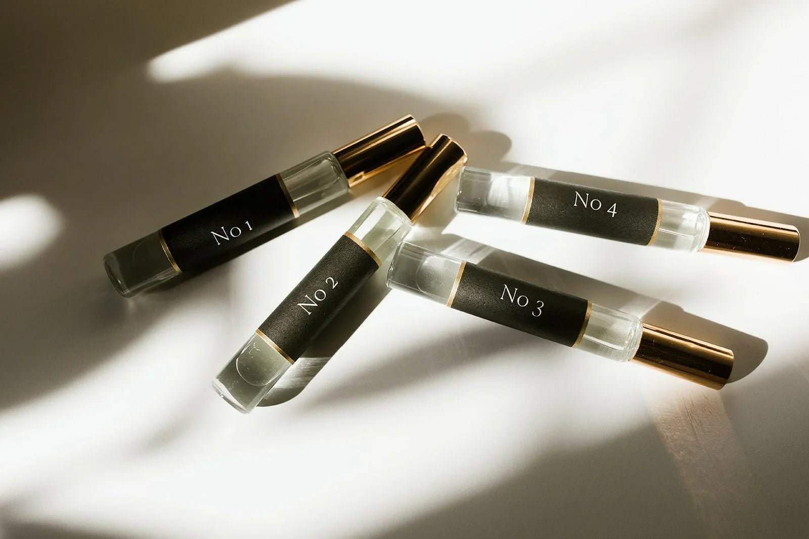 No. 3 - Brume Ardente Roll On Perfume Oil in a clear glass vial with black label and gold cap