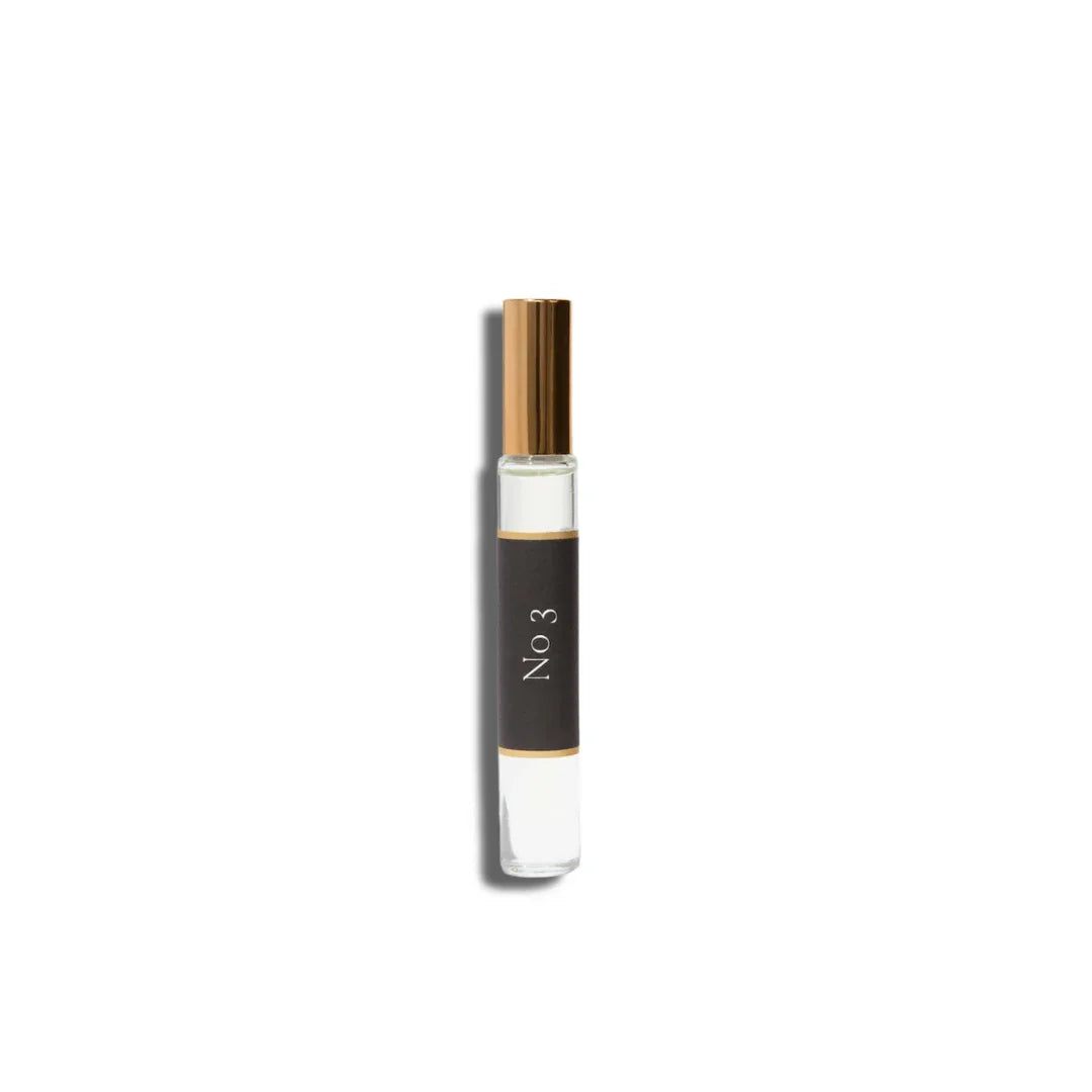 No. 3 - Brume Ardente Roll On Perfume Oil in a clear glass vial with black label and gold cap