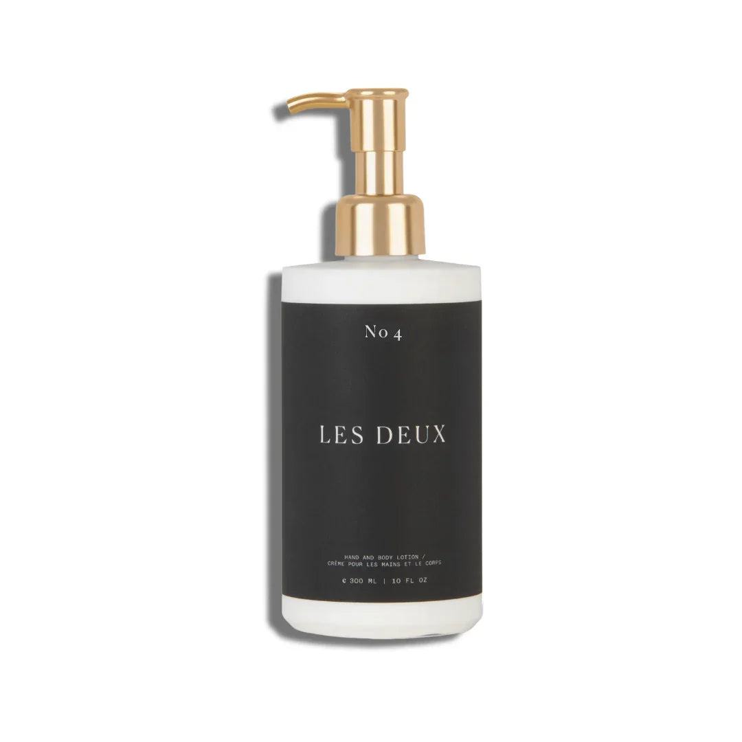 No. 4 - L'Âme Velours Body Lotion in a black cylindrical bottle with a gold pump dispenser and white base
