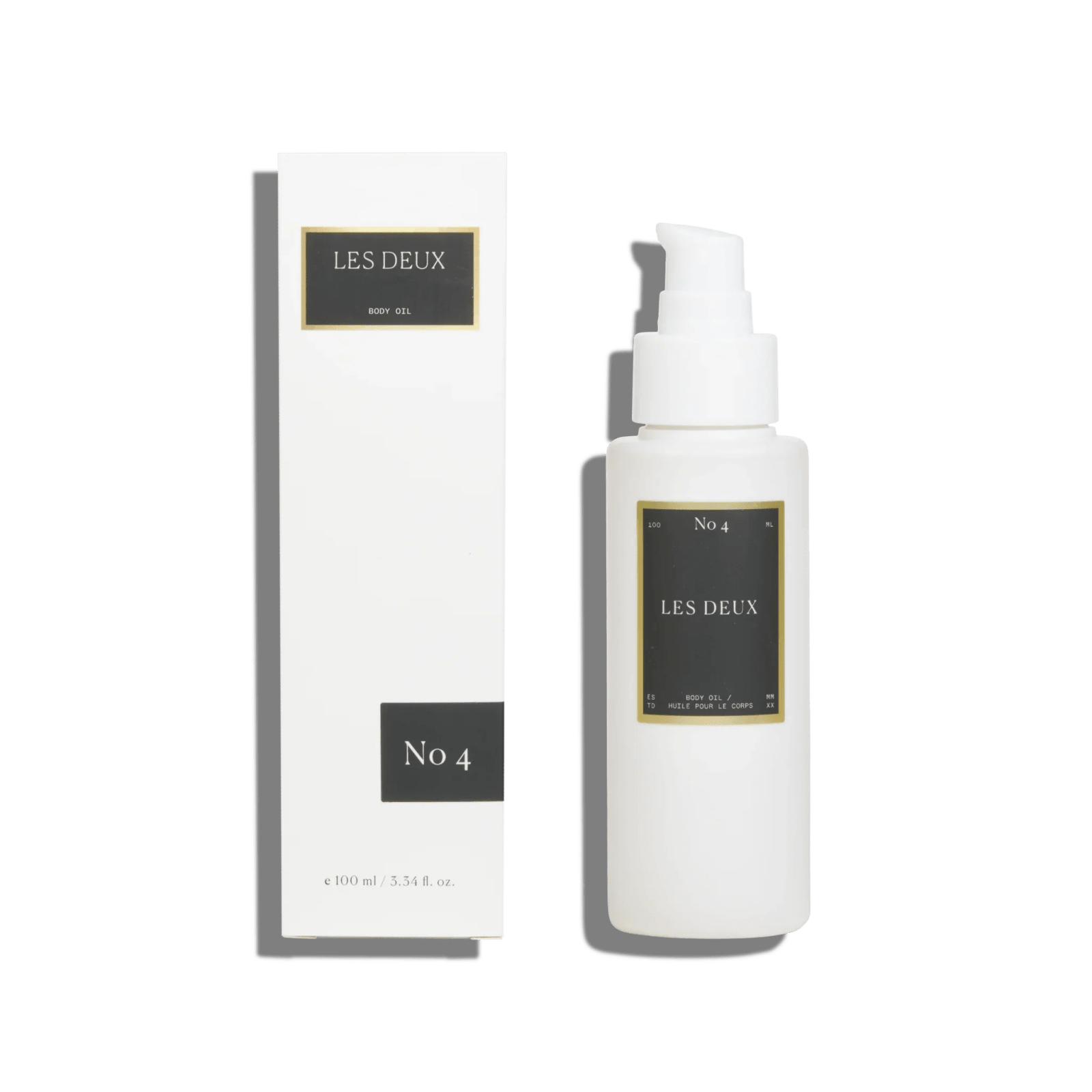 No. 4 - L'Âme Velours Body Oil, white bottle with pump and matching box, dark grey and gold labels