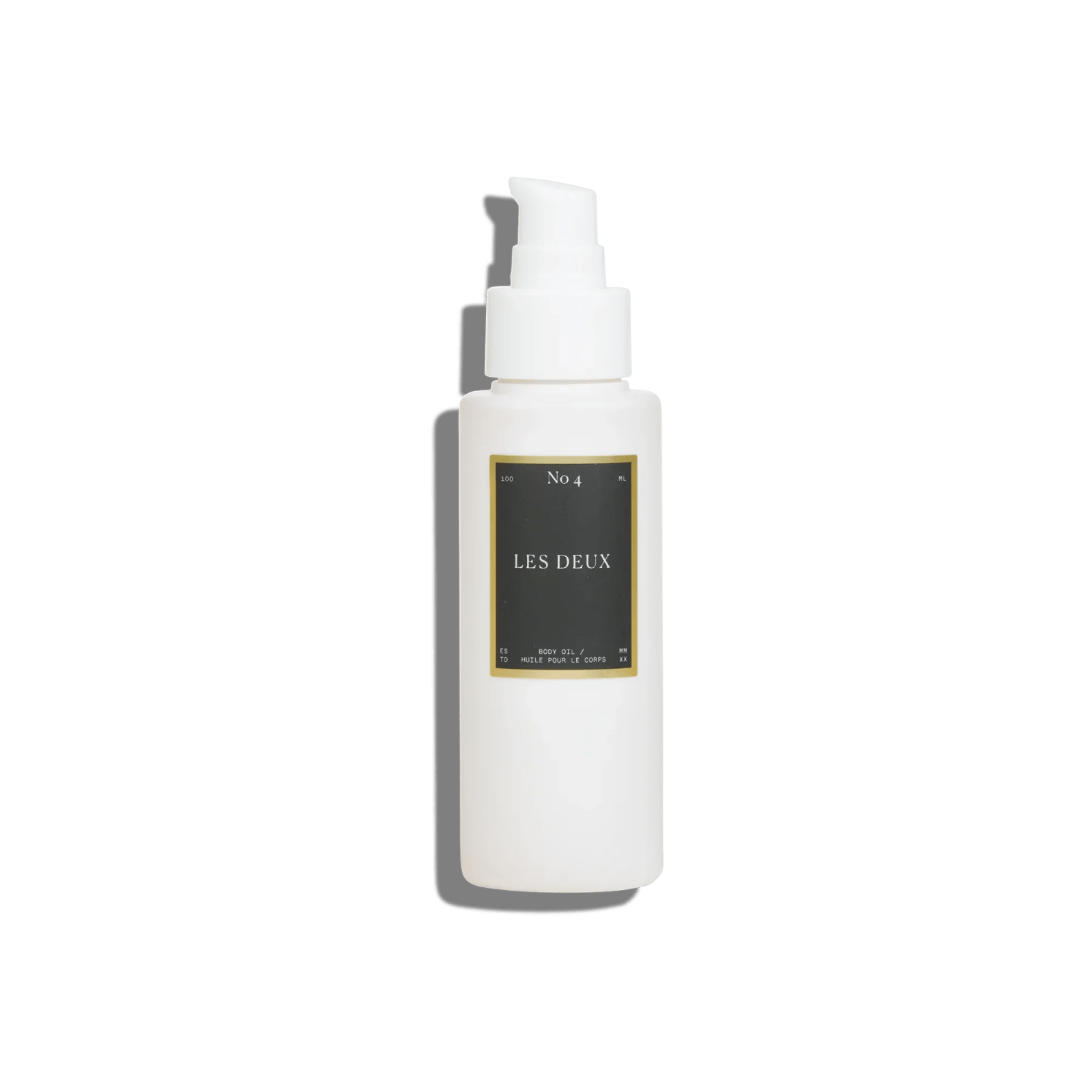 No. 4 - L'Âme Velours Body Oil in a white pump bottle with a black and gold LES DEUX label