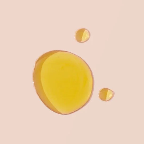 Body oil, No. 4 - L'Âme Velours Body Oil, shown as glossy golden-yellow oil droplets with a smooth texture