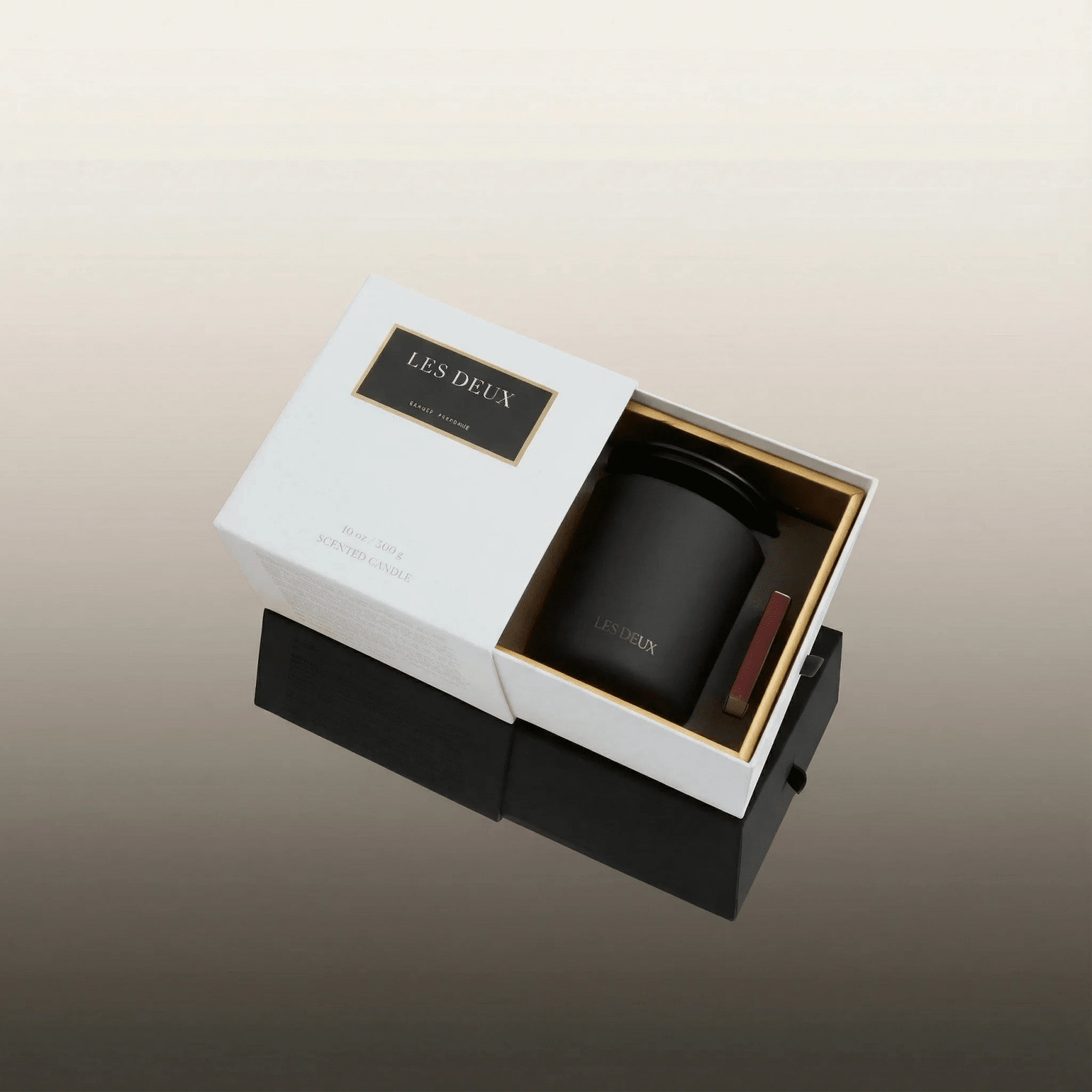 No. 4 - L'Âme Velours Candle in a matte black vessel with matching lid, presented in a white box with matches