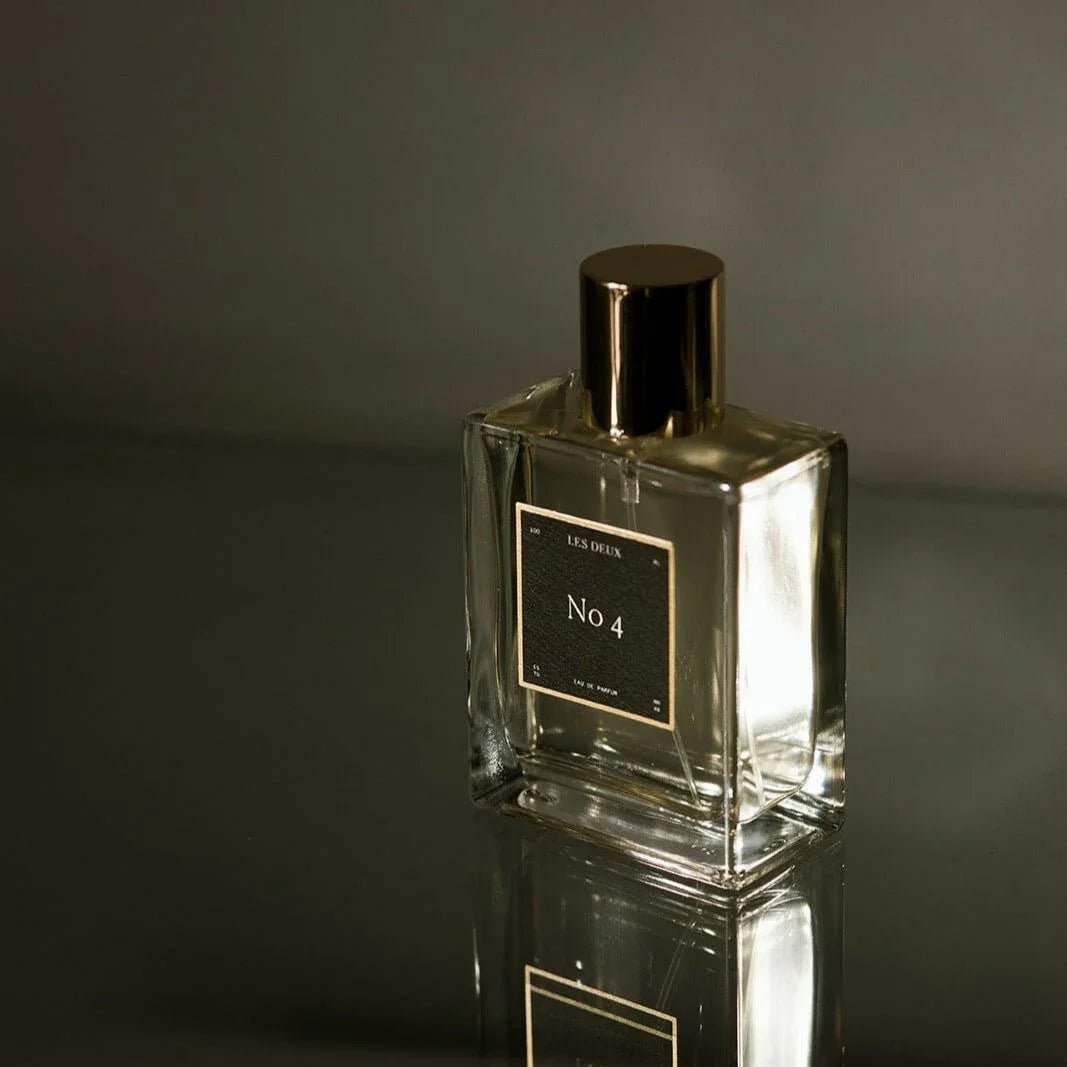 No. 4 - L'Âme Velours Perfume in a clear glass bottle with a black label and metallic black cap