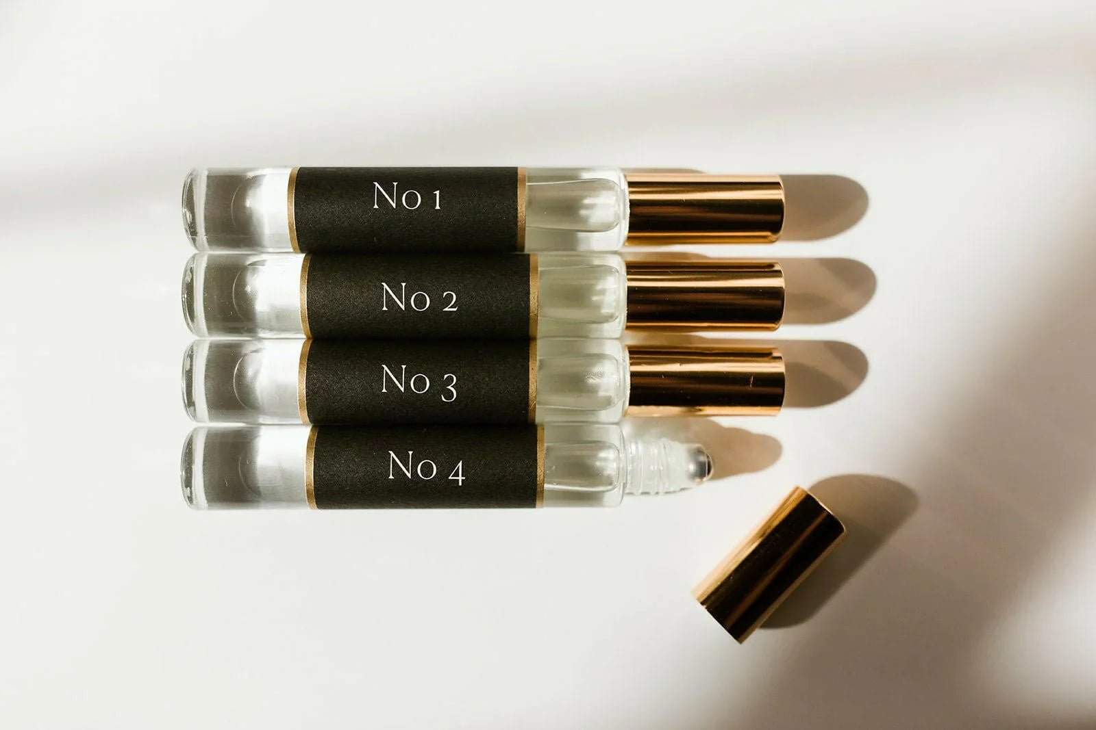 No. 4 - L'Âme Velours Roll On Perfume Oil, clear glass vial with black label and gold cap