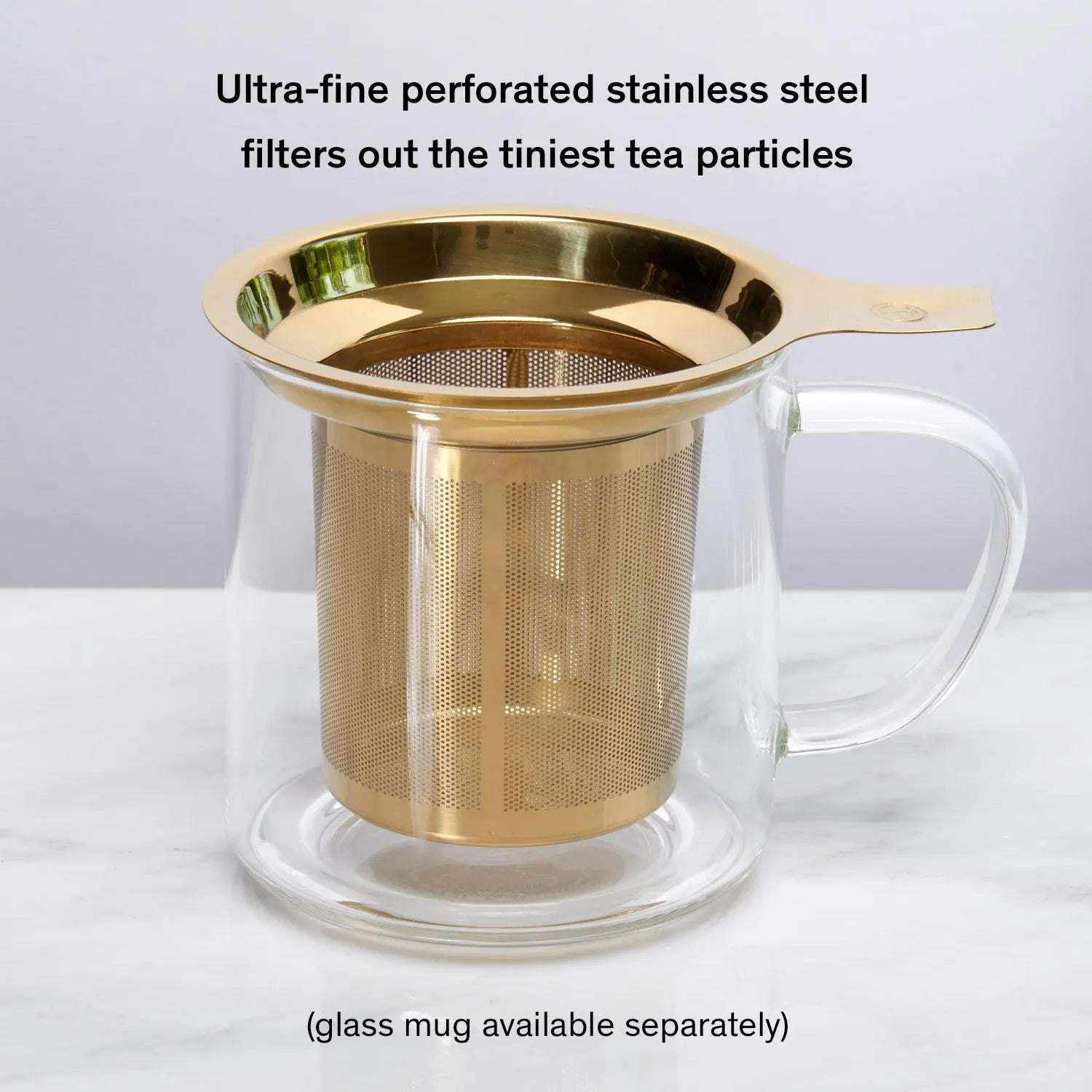 One Cup Infuser with gold-tone stainless steel micro-mesh basket and wide rim, shown inside a clear glass mug