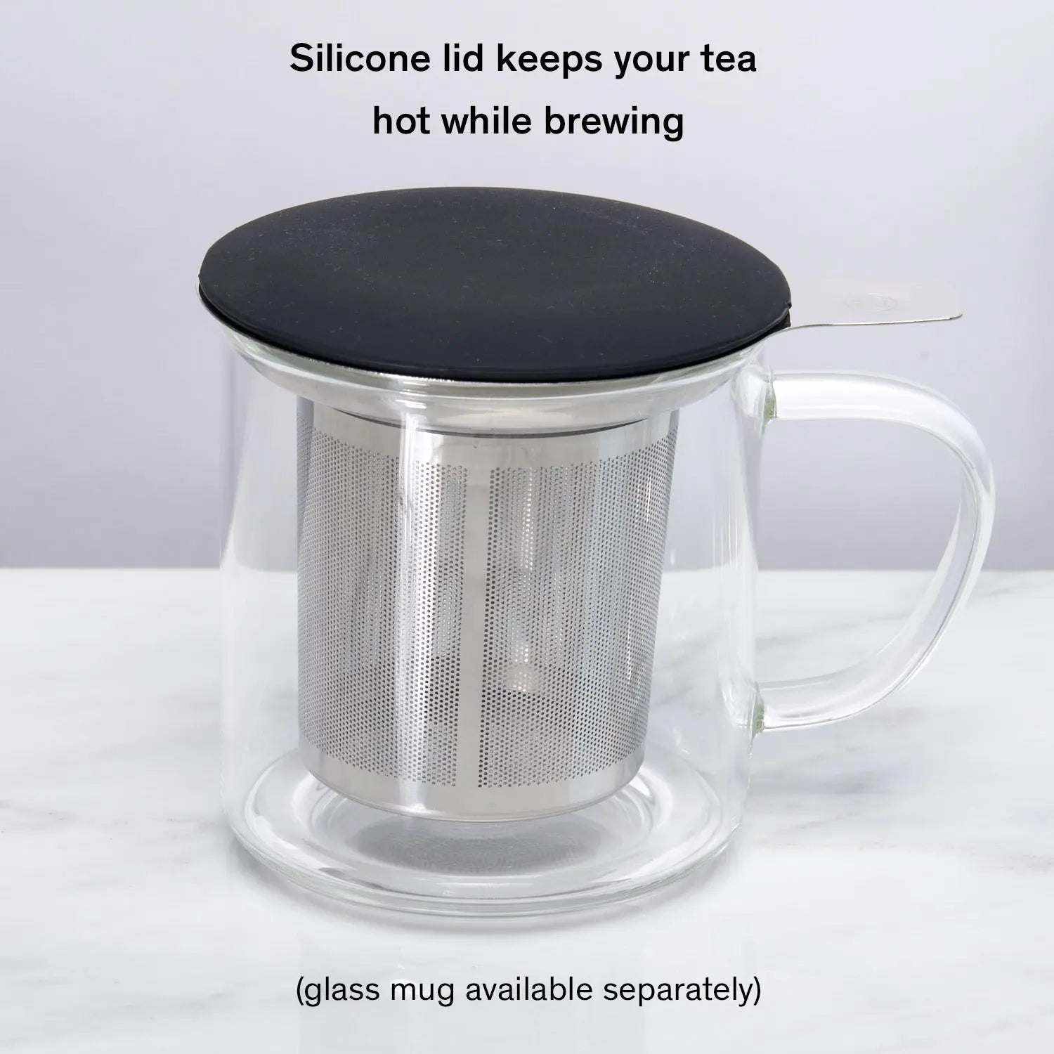 One Cup Infuser with stainless steel micro mesh basket and black silicone lid inside a clear glass mug