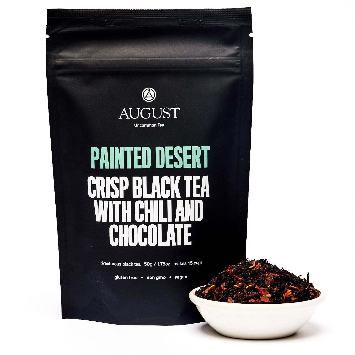 Painted Desert Tea black tea pouch with bold lettering and a bowl of loose chili chocolate tea leaves