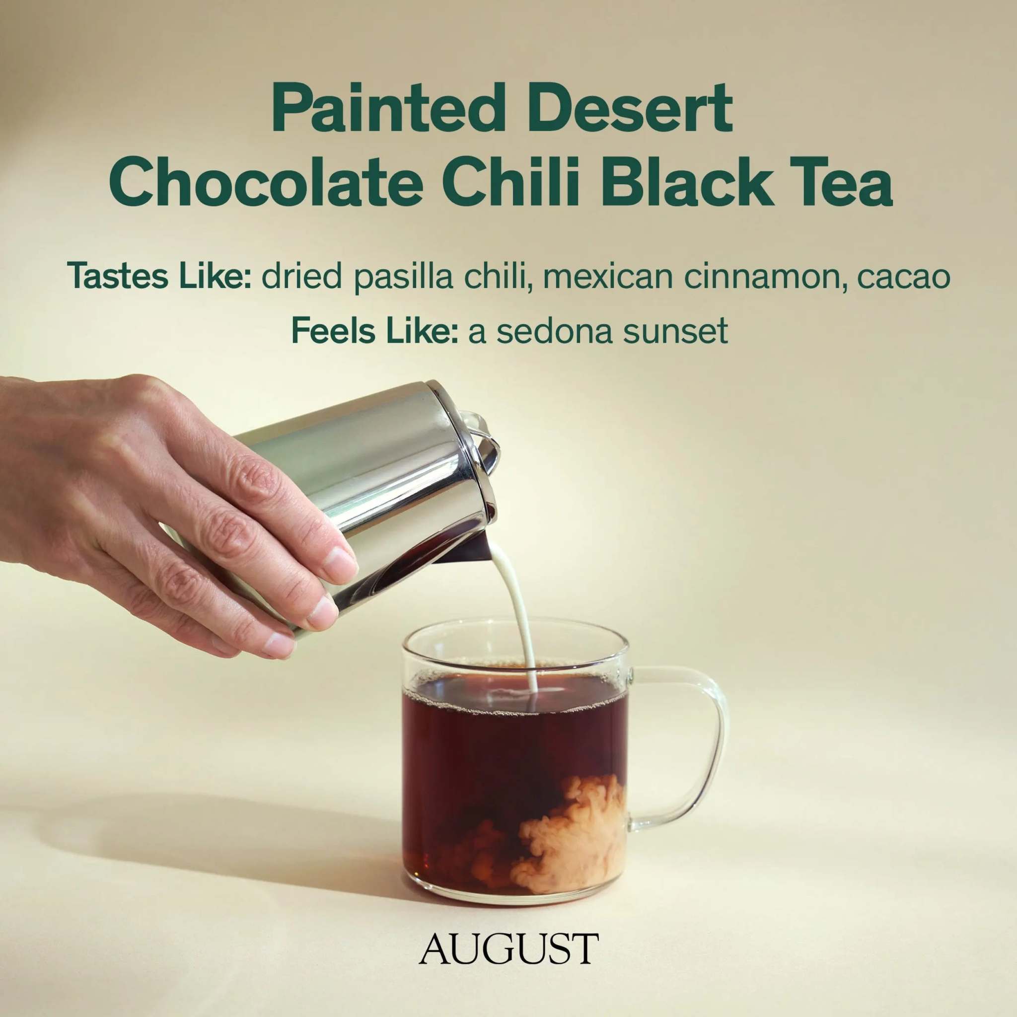 Painted Desert Tea black tea in a clear glass mug, dark amber brew with creamy milk swirling from a metal pitcher