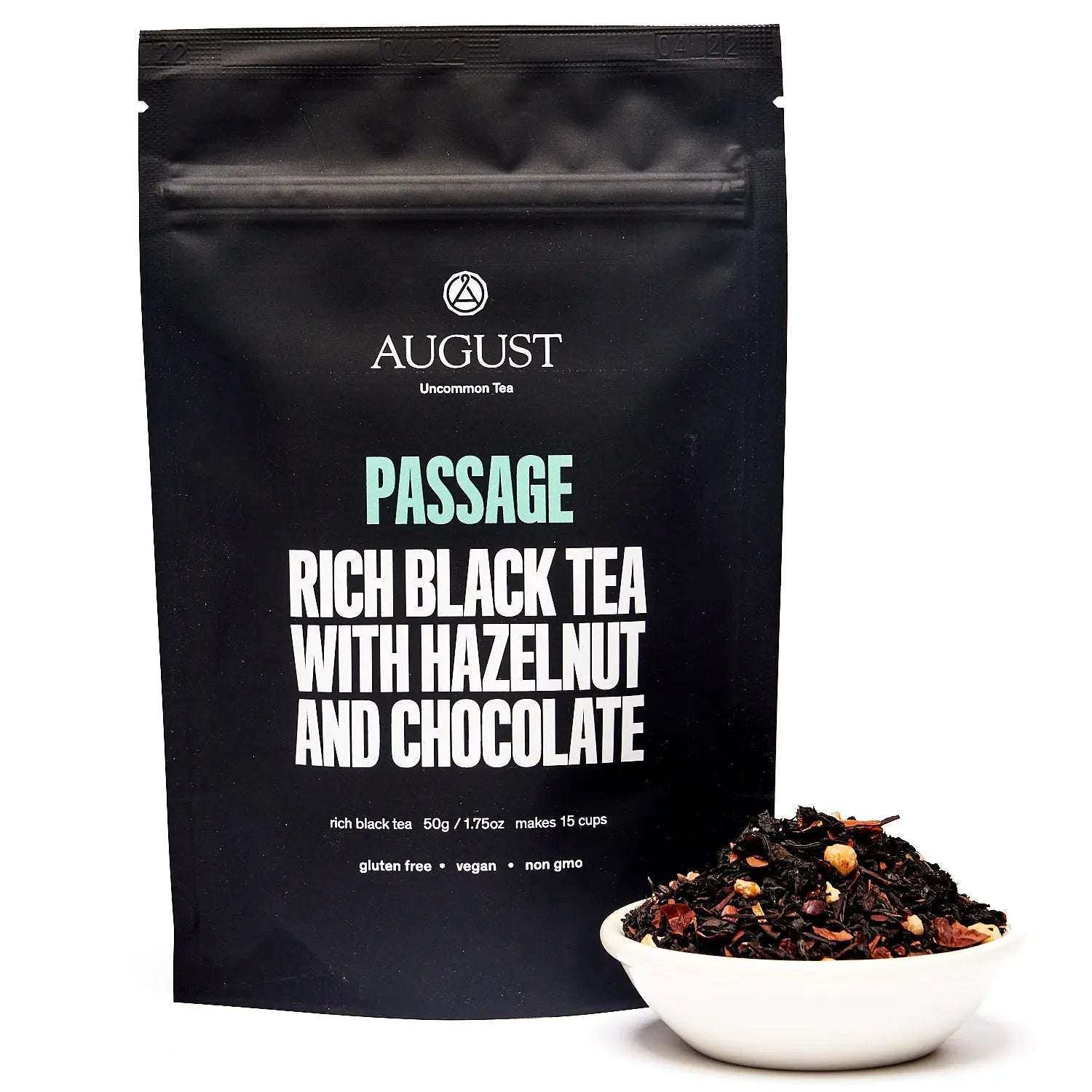 Passage - Hazelnut Chocolate Black Tea in a black resealable pouch with loose dark tea and hazelnut pieces in a bowl