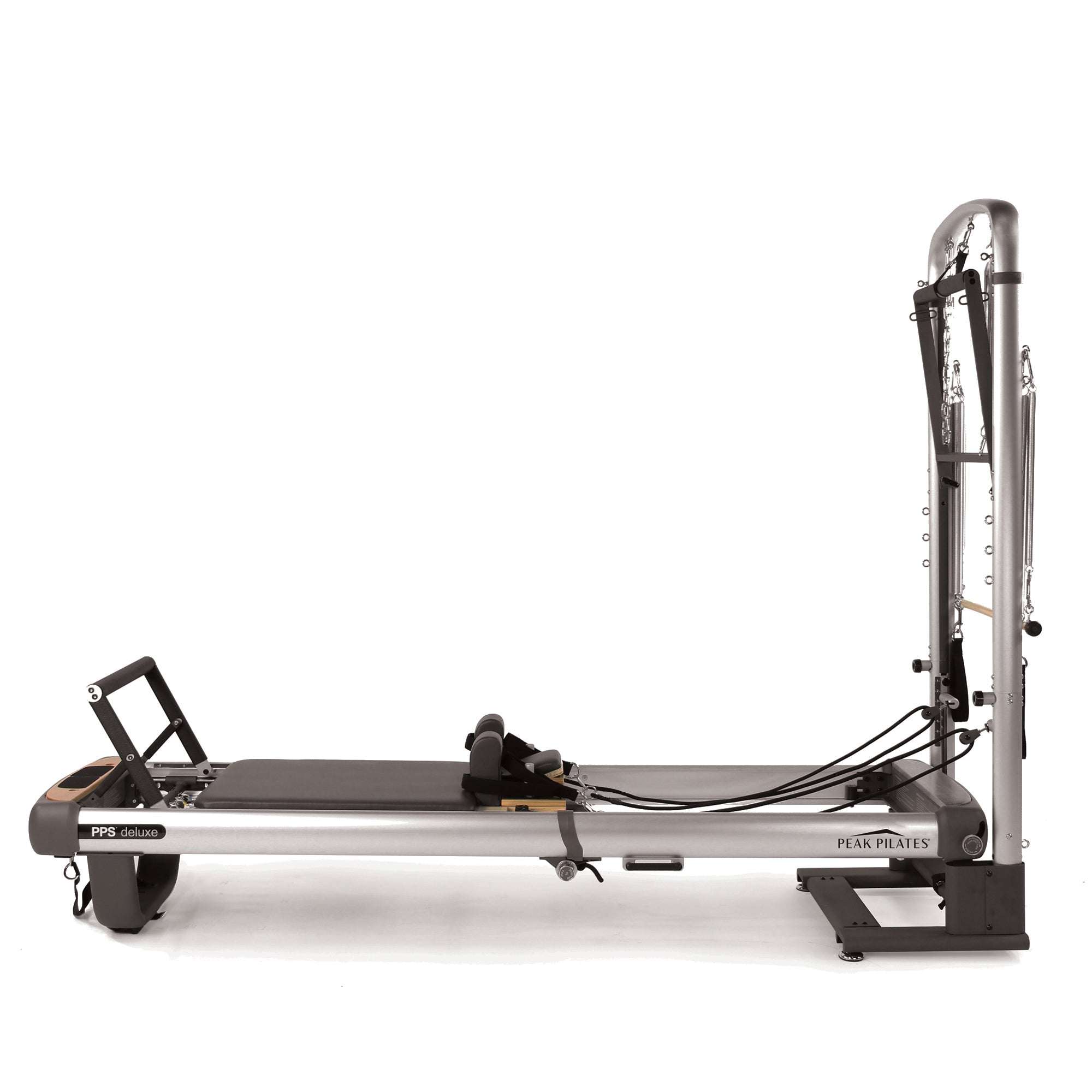 Pilates reformer machine in gray and black with metal frame and adjustable ropes, part of the Peak PilateSystem® Deluxe Bundle