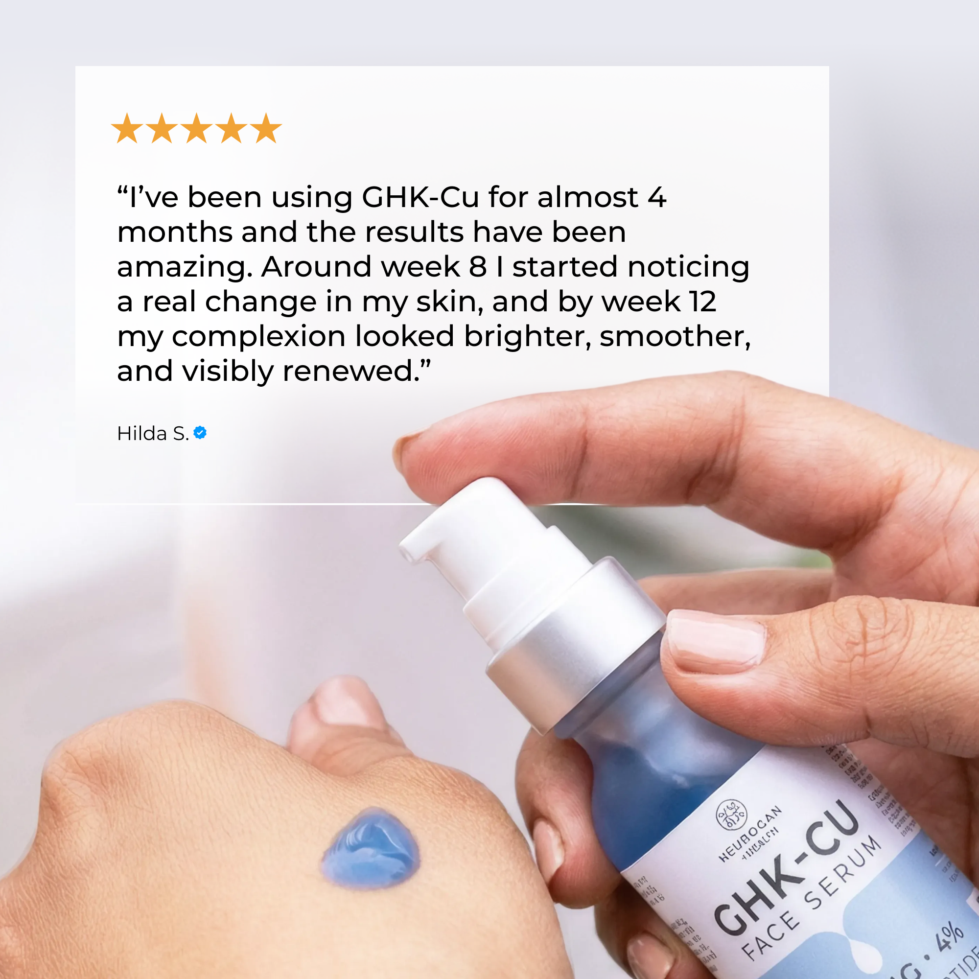 GHK-Cu Peptide serum in a blue and white pump bottle with a small amount of gel dispensed on skin, showing smooth texture.