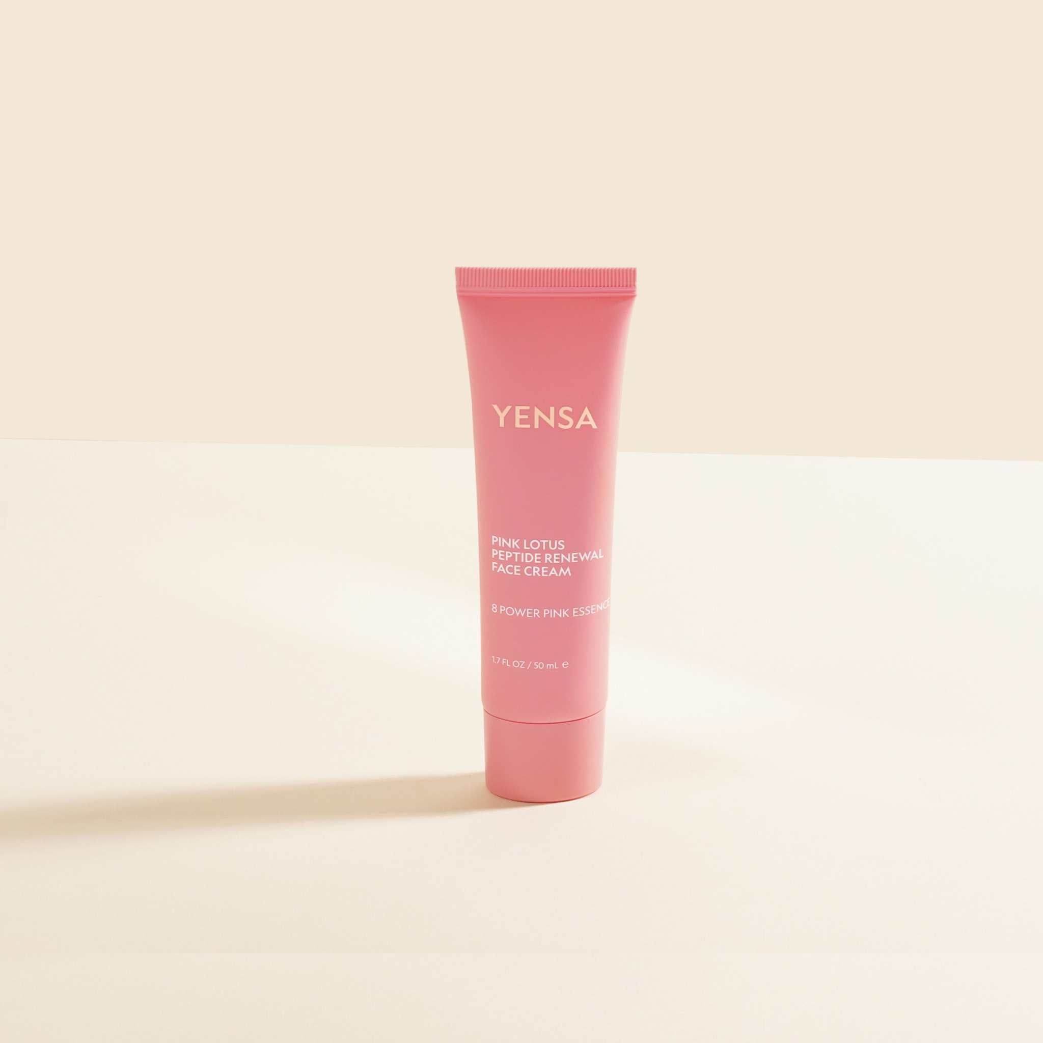 Jar of Pink Lotus Peptide Renewal Face Cream with lotus flowers