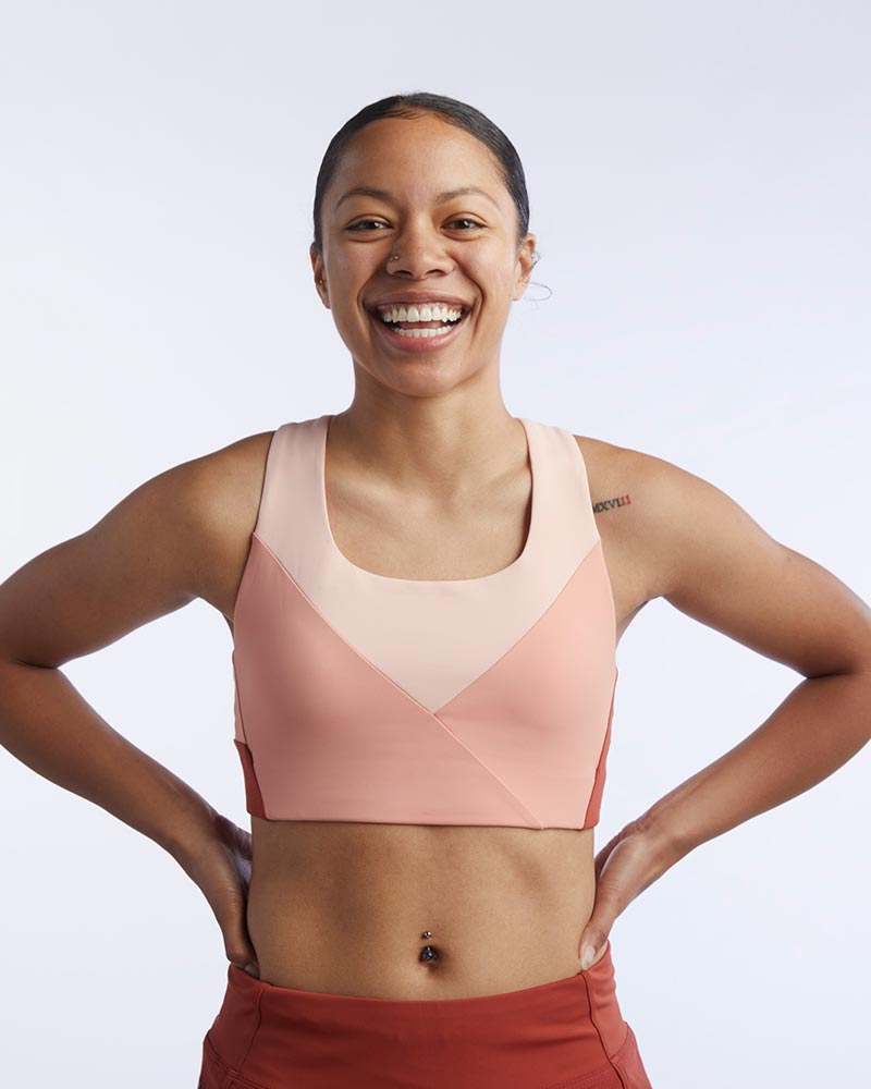 Pionxr Bra Top in blush pink with wide straps, a scoop neckline, clean seams and a crossover color-blocked front