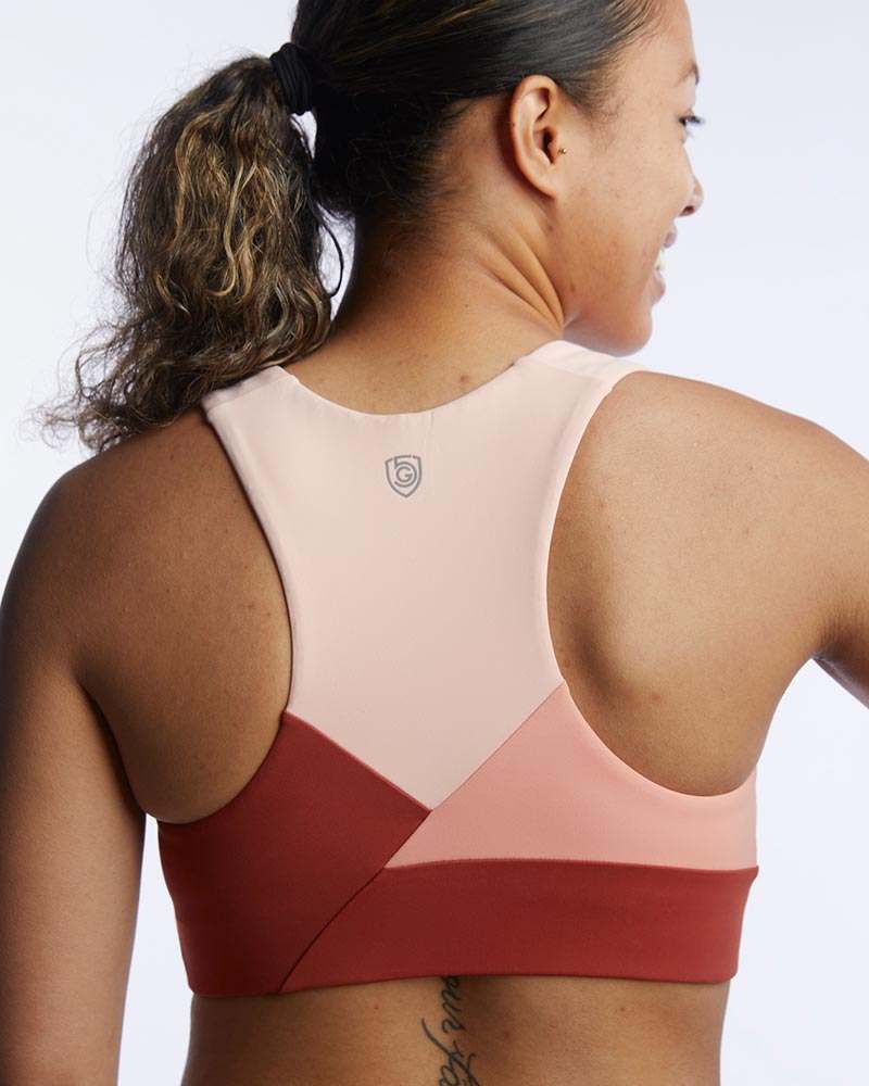 Pionxr Bra Top in blush pink and deep red color-blocked fabric, with a racerback cut and clean seams