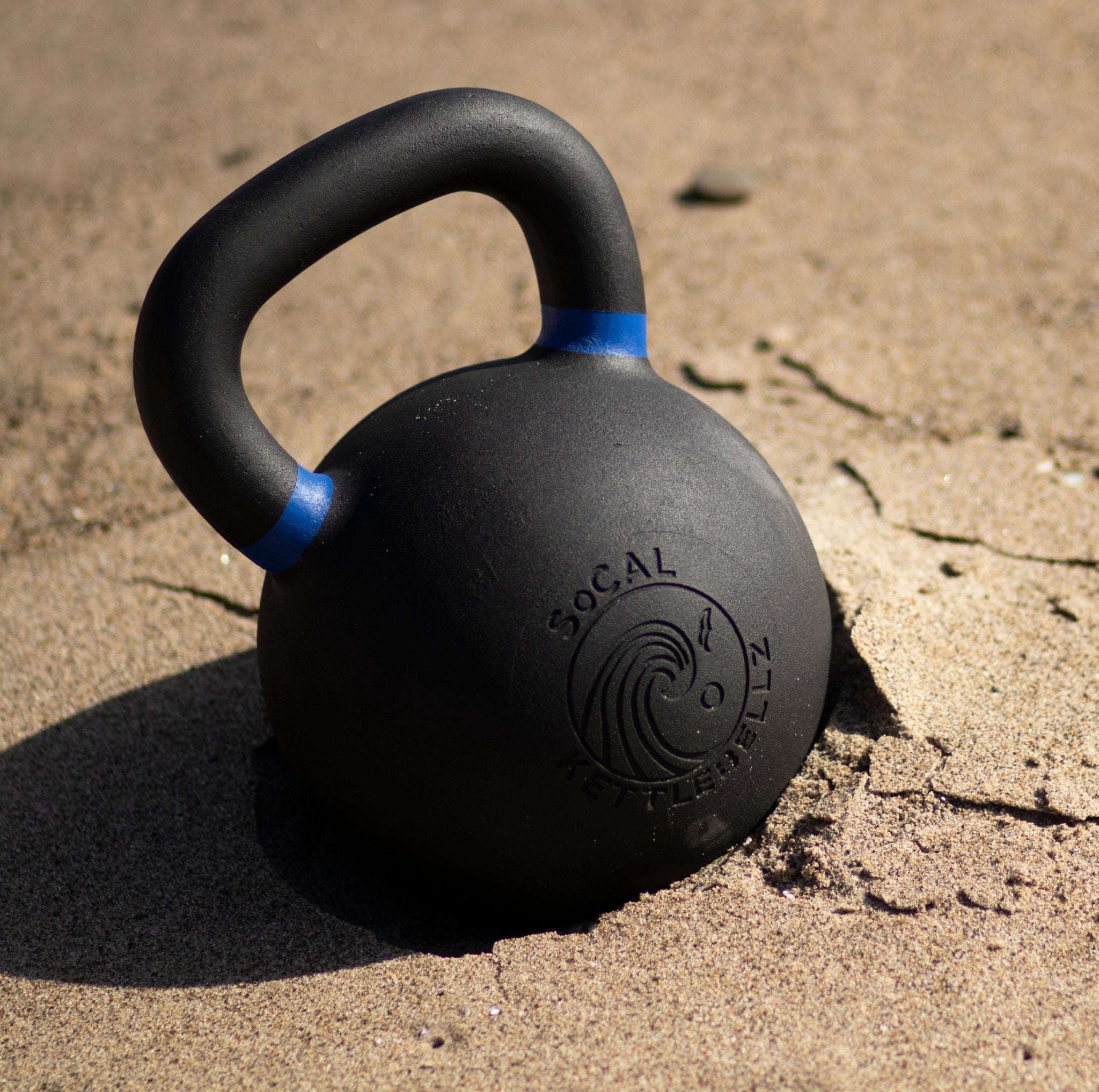 Powder coated kettlebell with textured grip and color weight indicator