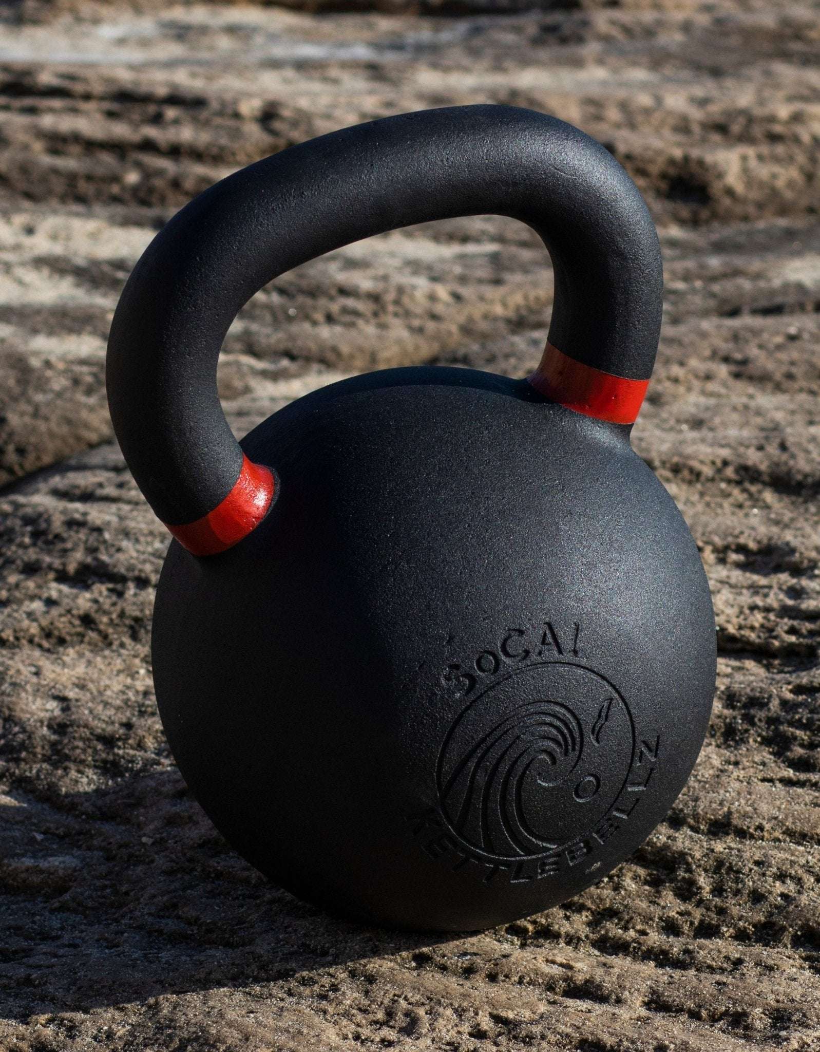 Powder coated kettlebell with textured grip and color weight indicators