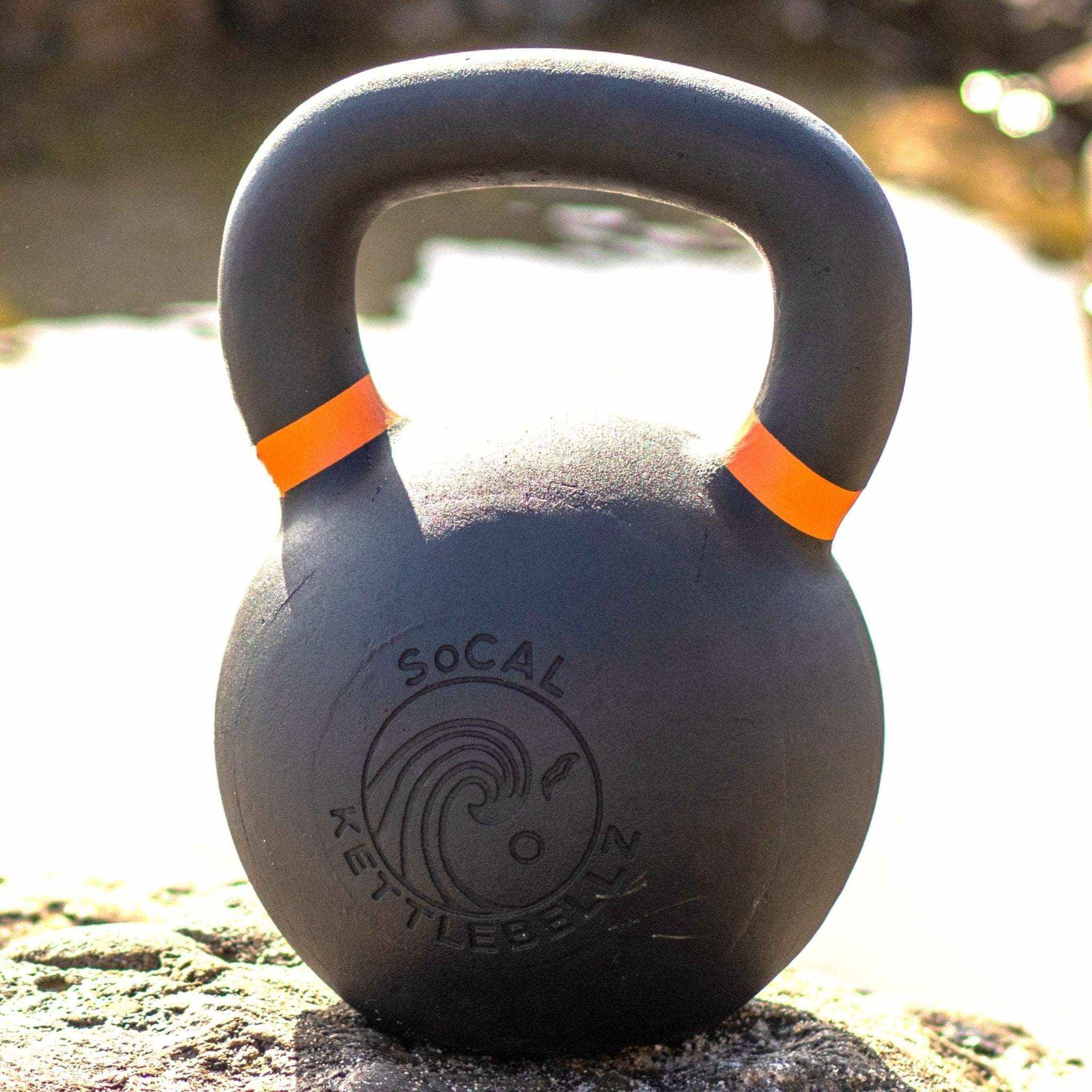 Powder coated cast iron kettlebell with textured grip and color weight indicators