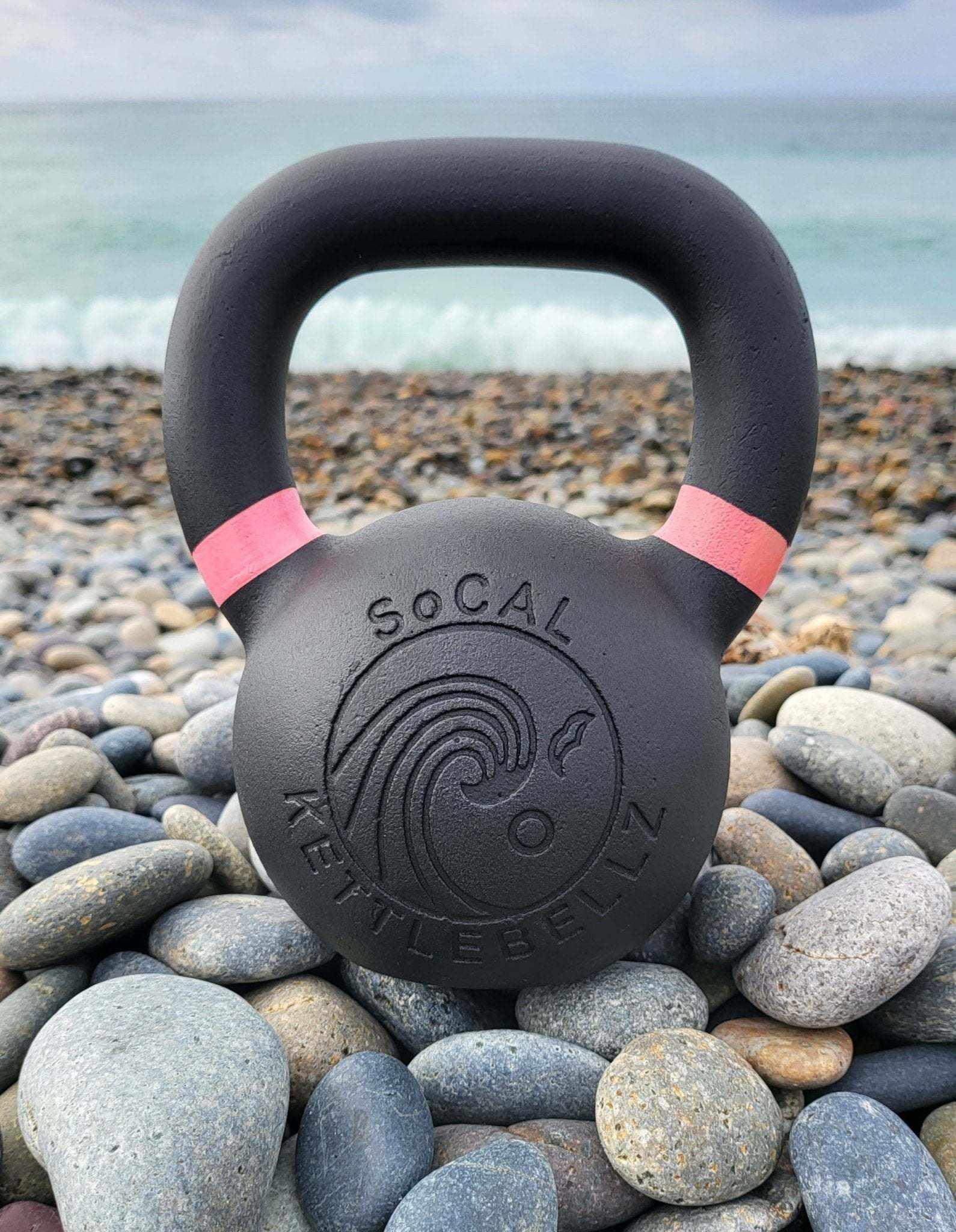 Powder coated kettlebell with textured grip and color weight indicators