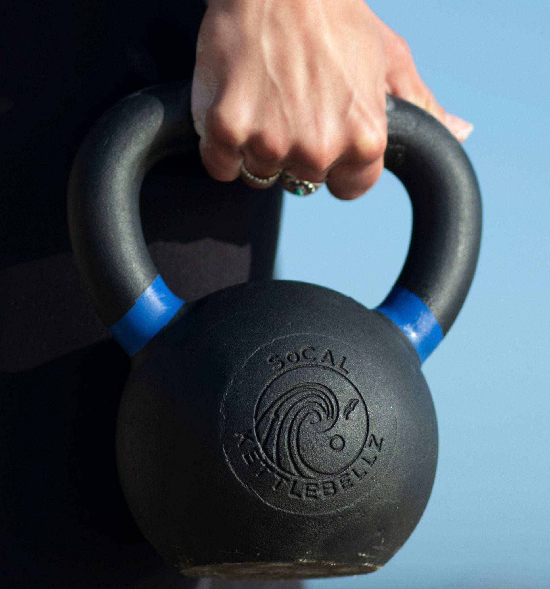 Powder coated kettlebell with textured grip and color weight indicators