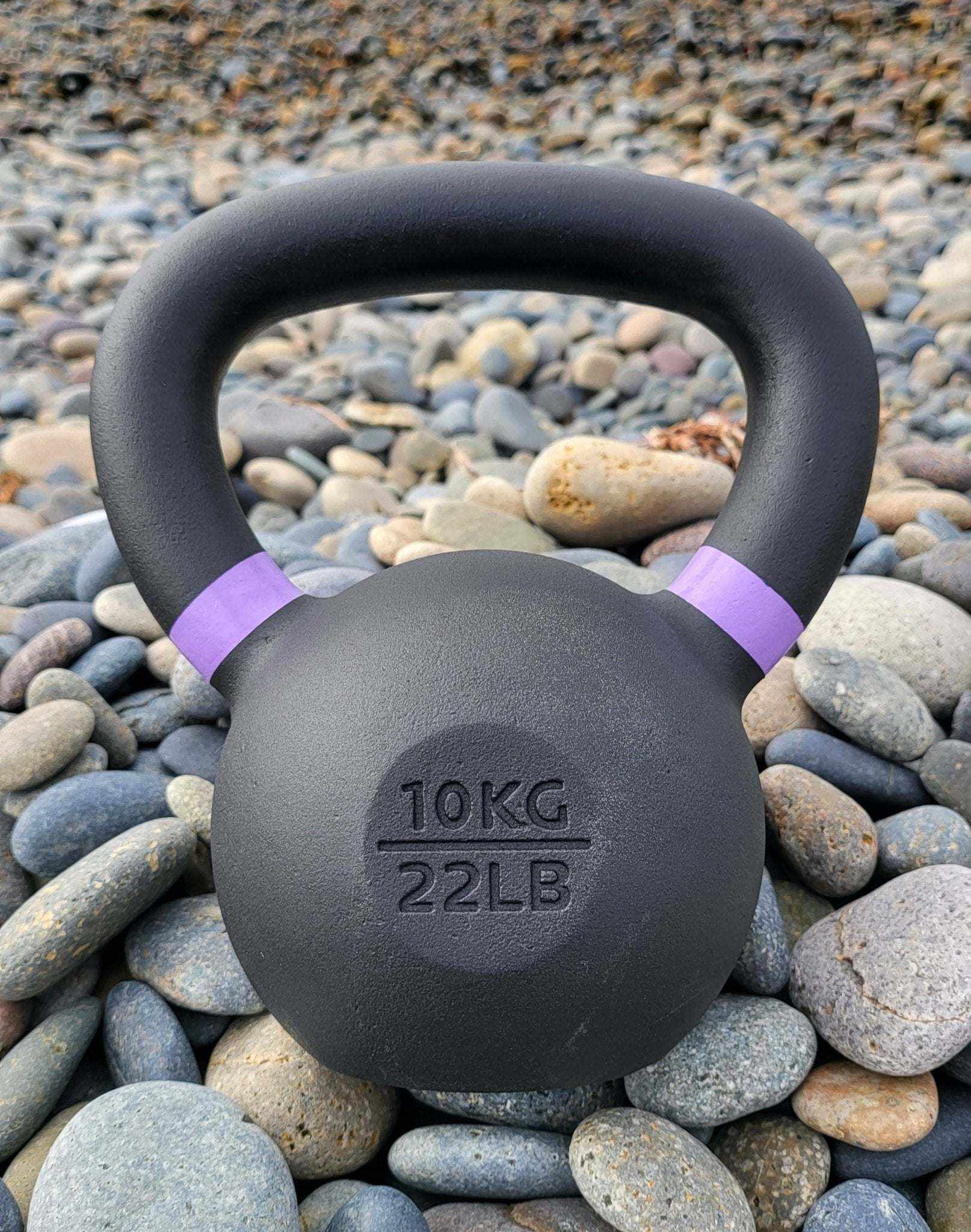 Powder coated kettlebell with textured grip and color weight indicator