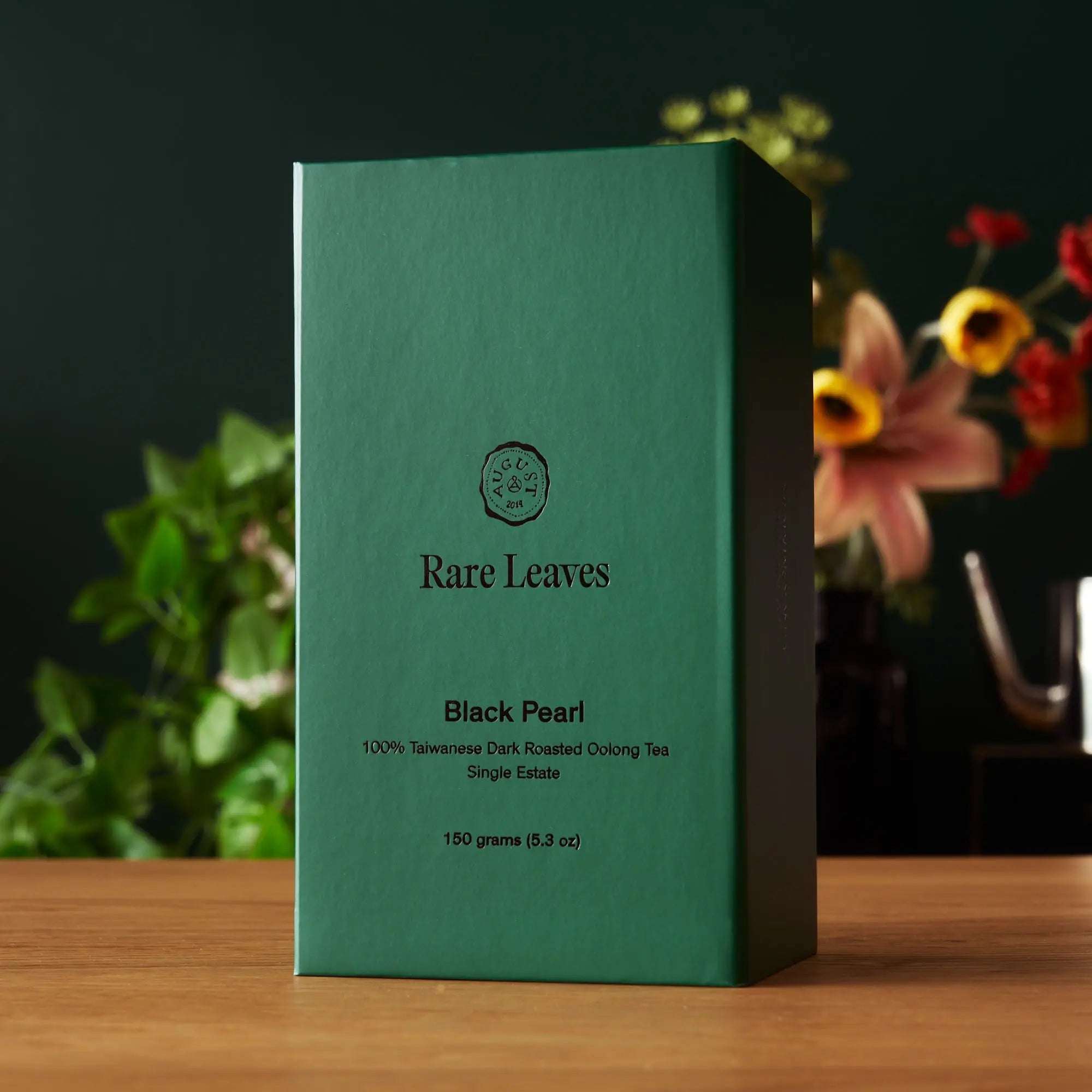 Premium Loose Leaf Tea Black Pearl in a green rectangular tin, featuring Taiwanese dark roasted oolong tea
