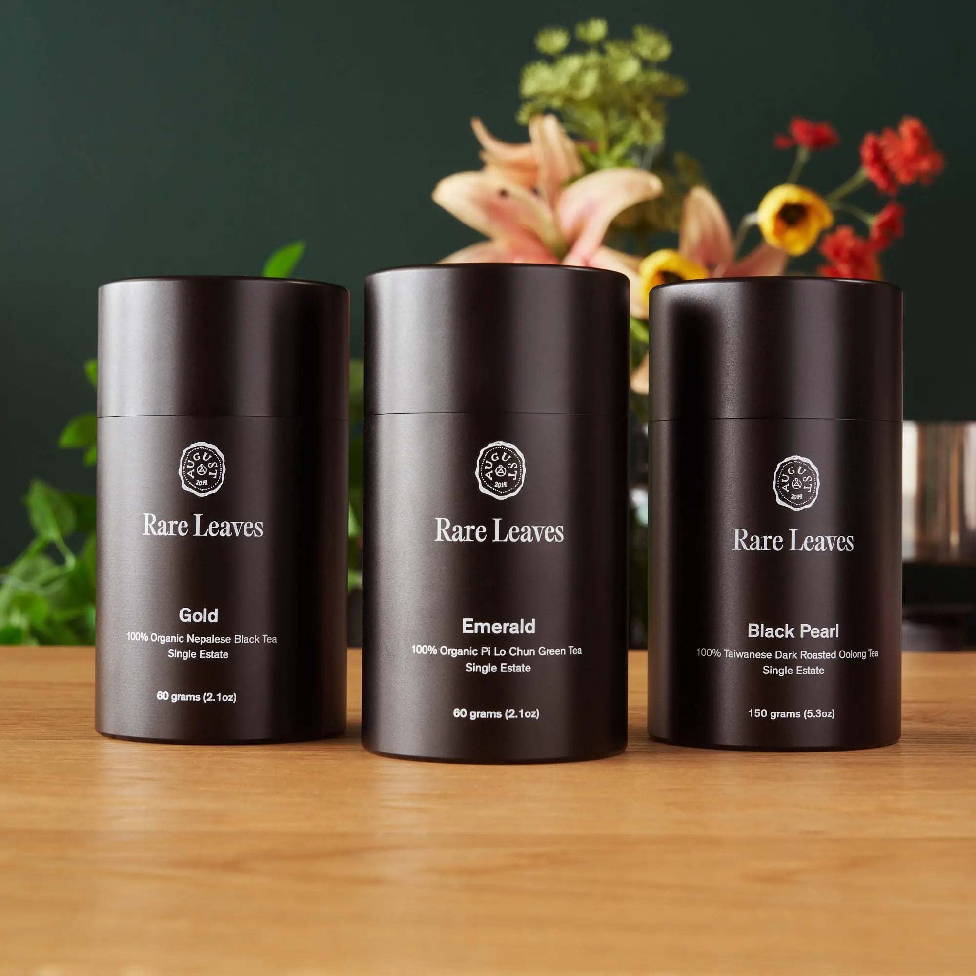 Premium Loose Leaf Tea gift set with three matte black Rare Leaves tea tins: Gold, Emerald, and Black Pearl