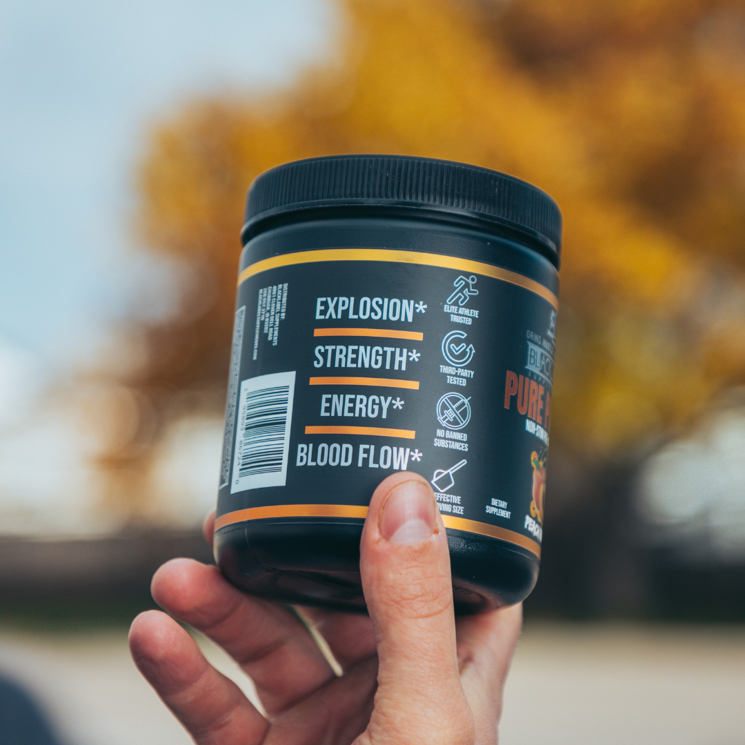 PURE POWER sports supplement in a dark teal plastic tub with a black lid and orange-yellow label accents