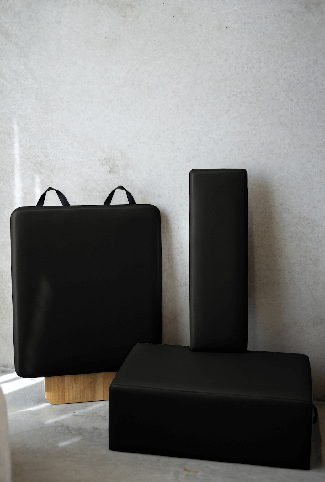 Queen Folding Reformer black padded cushions including box, jump board, and standing platform with leather-like material