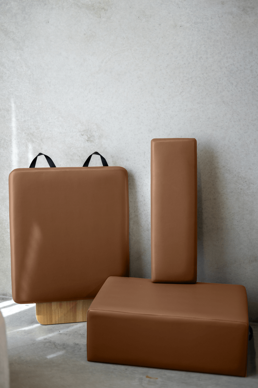 Queen Folding Reformer customised brown padded upholstery cushions including box, jump board, and standing platform in smooth leather-like material