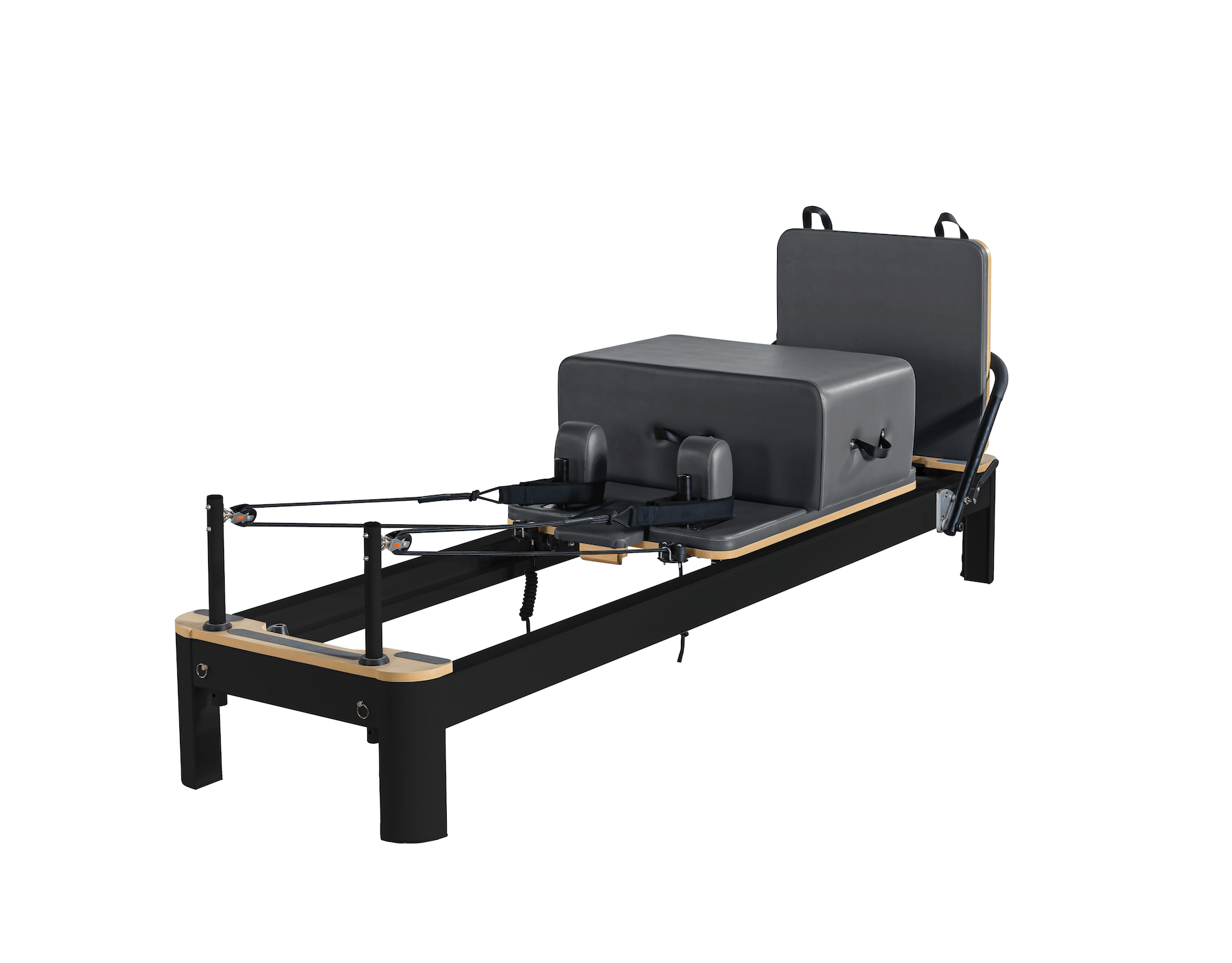 Queen Studio Reformer Pilates machine in black with charcoal padded carriage, footbar and tall backrest, plus tan trim.