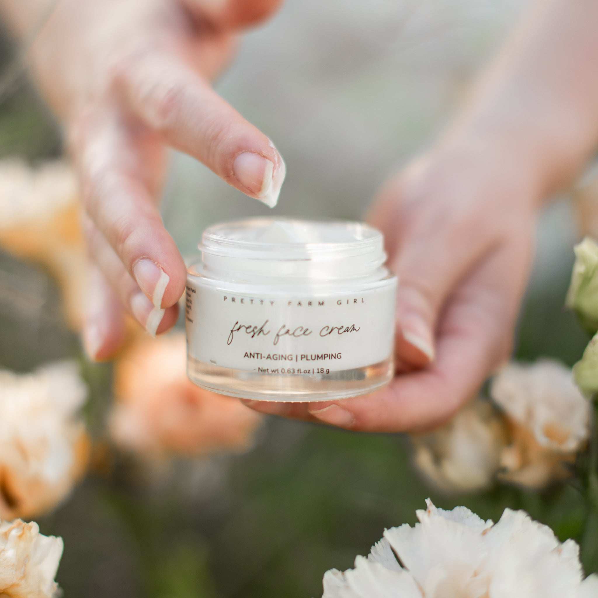 Radiance Glow Kit fresh face cream in a clear glass jar with white lid and anti-aging plumping label