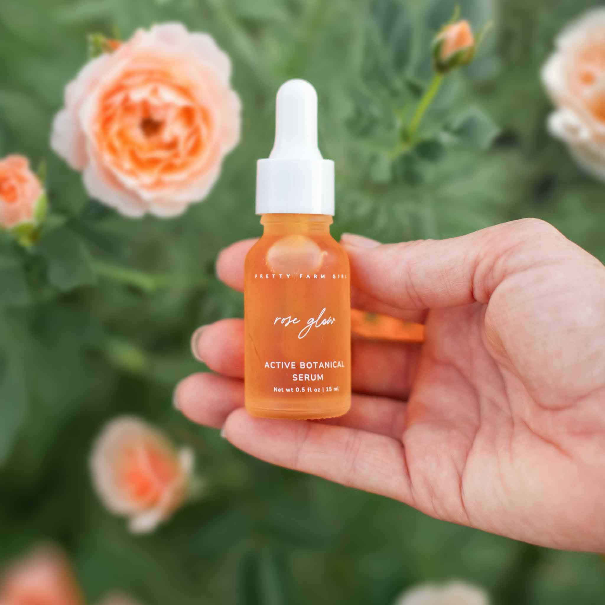 Radiance Glow Kit featuring an orange glass dropper bottle of Rose Glow Serum with a white pipette cap