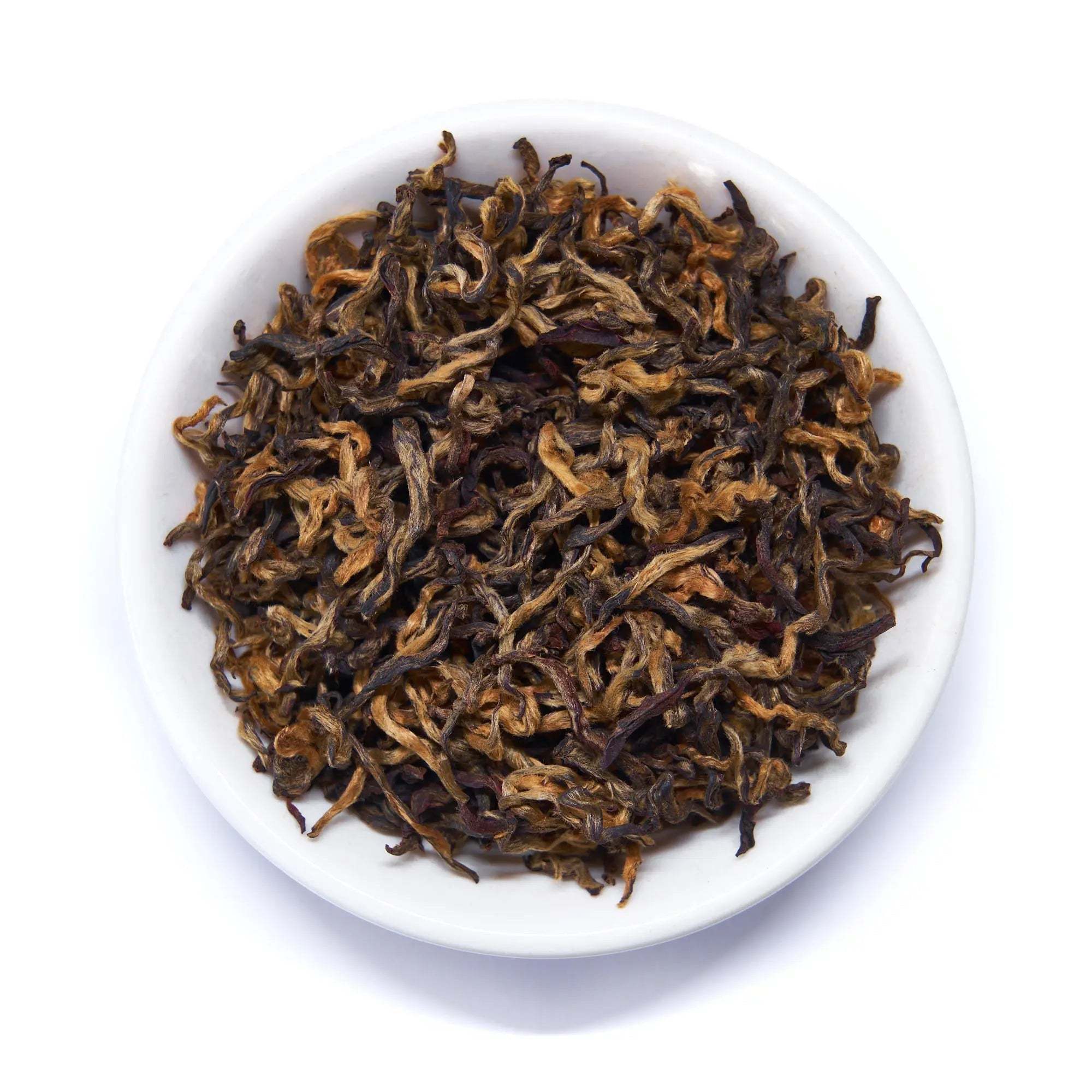 Rare Leaves - Nepalese Black Tea, loose black tea leaves with curled brown and dark leaves in a white bowl