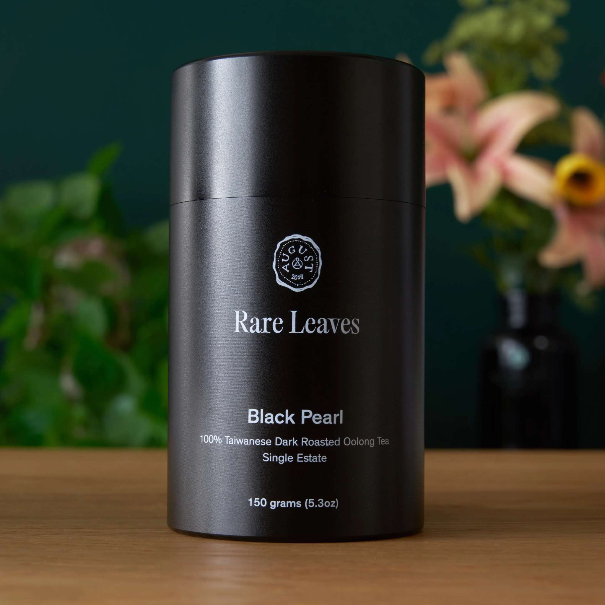 Rare Leaves - Single Estate Taiwanese Dark Oolong Tea in a black cylindrical tin with white lettering