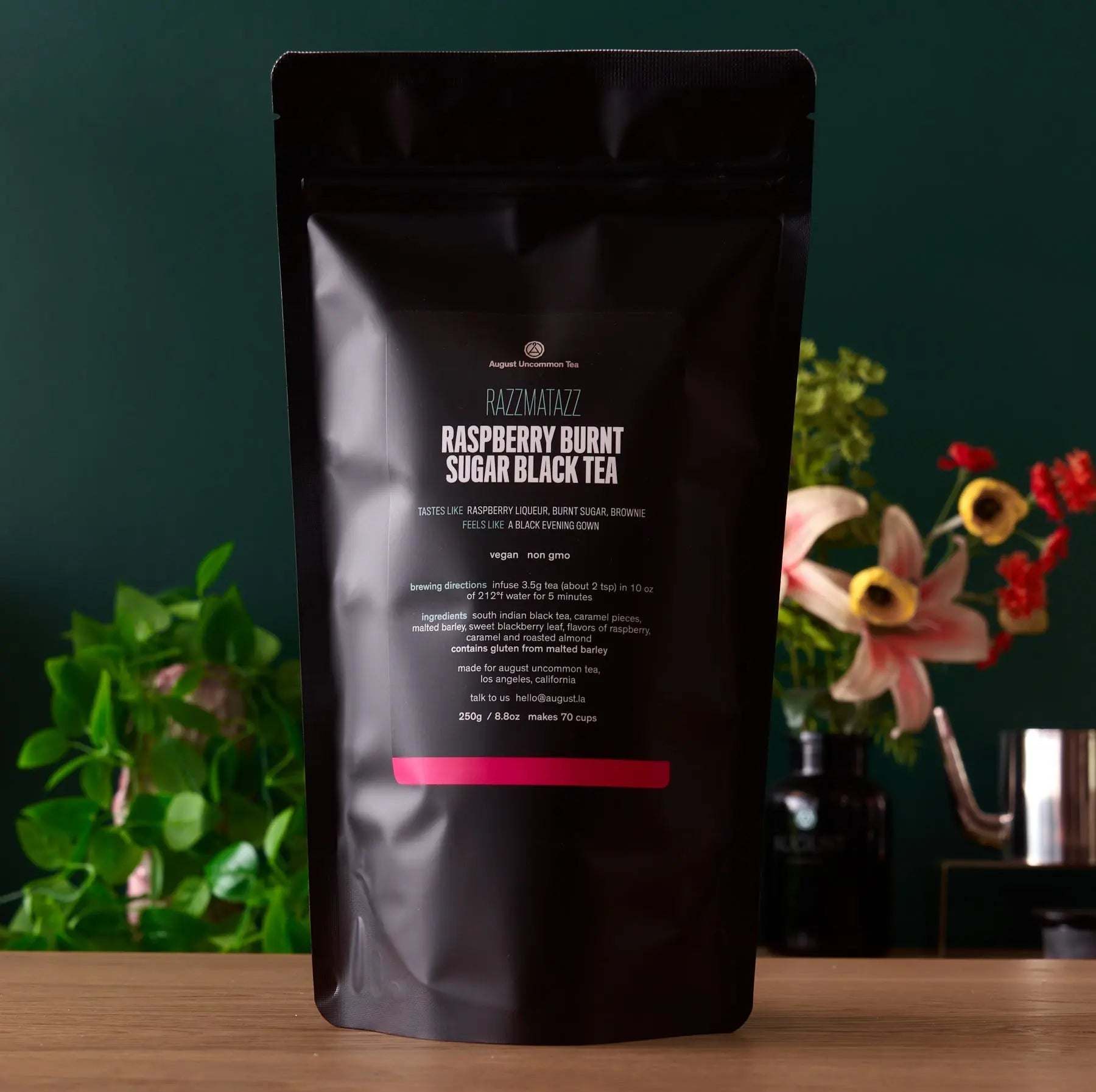 Razzmatazz - Raspberry Burnt Sugar Black Tea in a glossy black resealable pouch with pink label